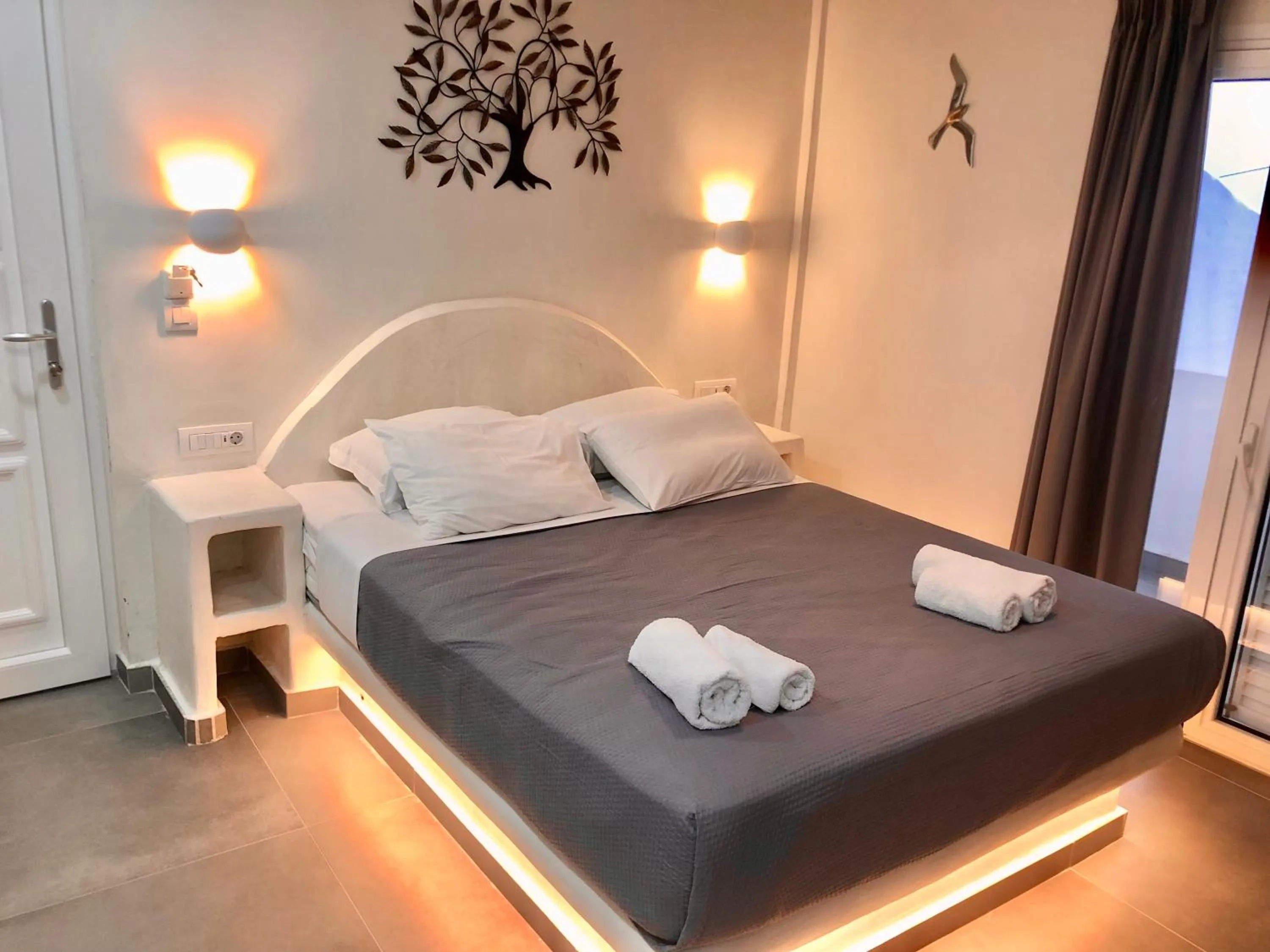 Bedroom, Bed in The Muses of Santorini Private Jacuzzi Suites