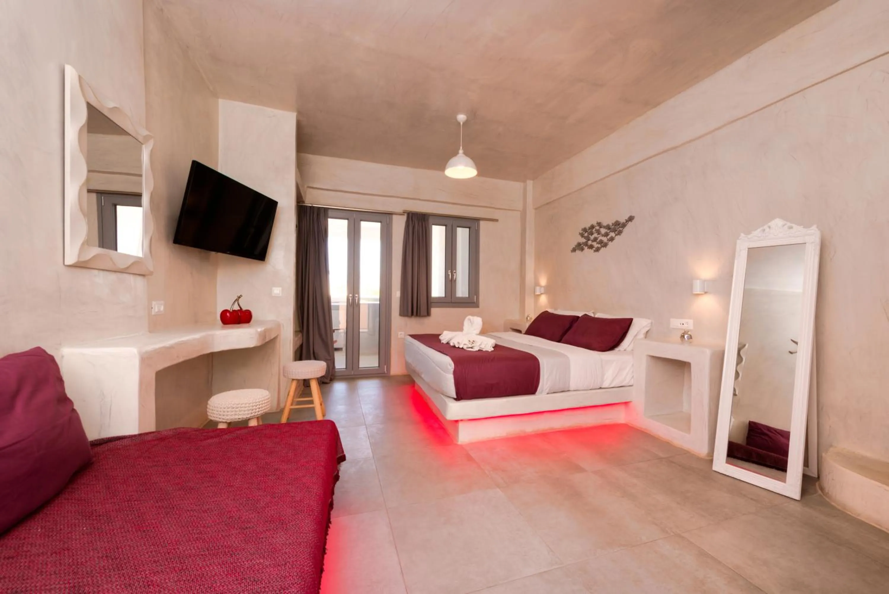 Photo of the whole room, Bed in The Muses of Santorini Private Jacuzzi Suites