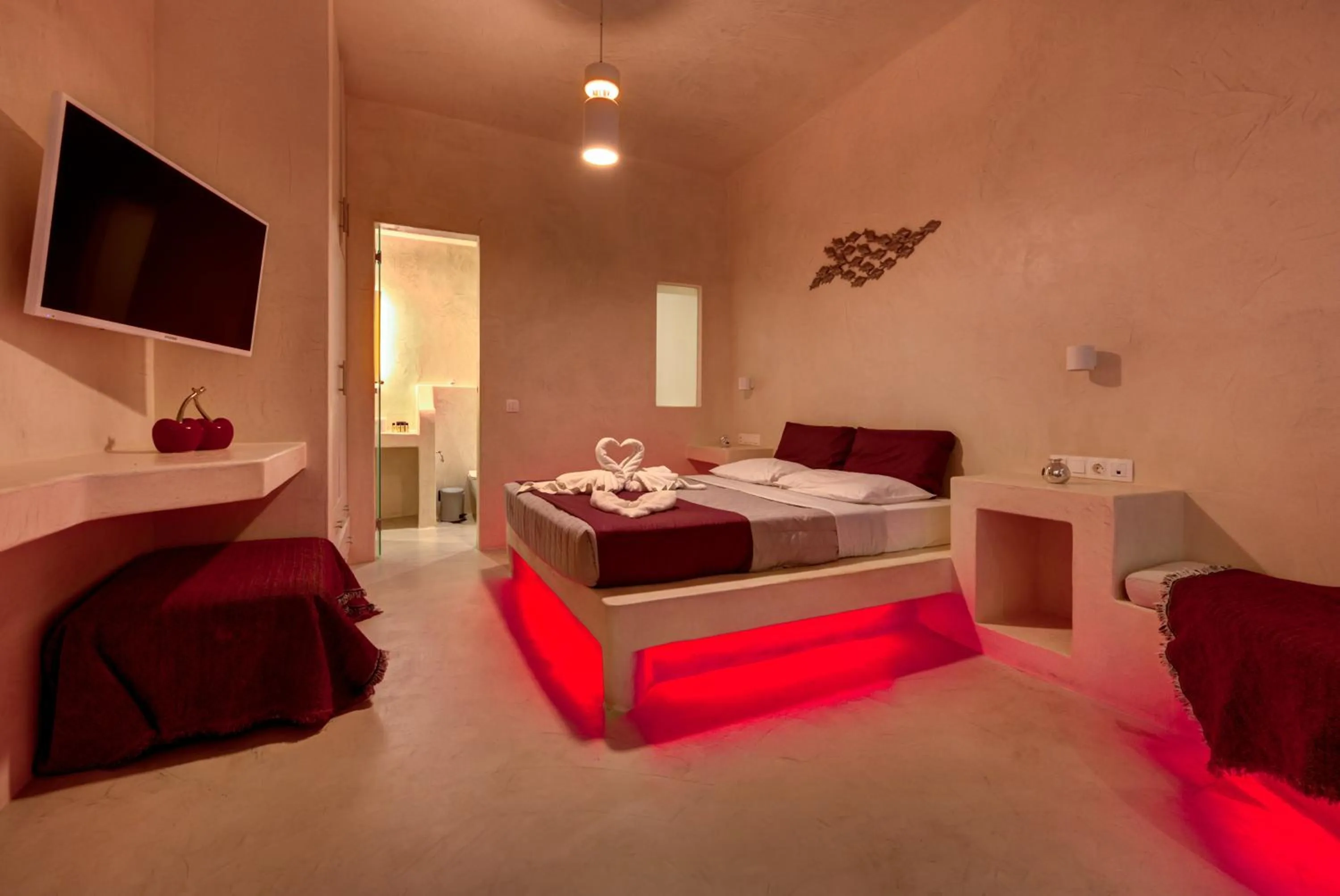Photo of the whole room, Bed in The Muses of Santorini Private Jacuzzi Suites
