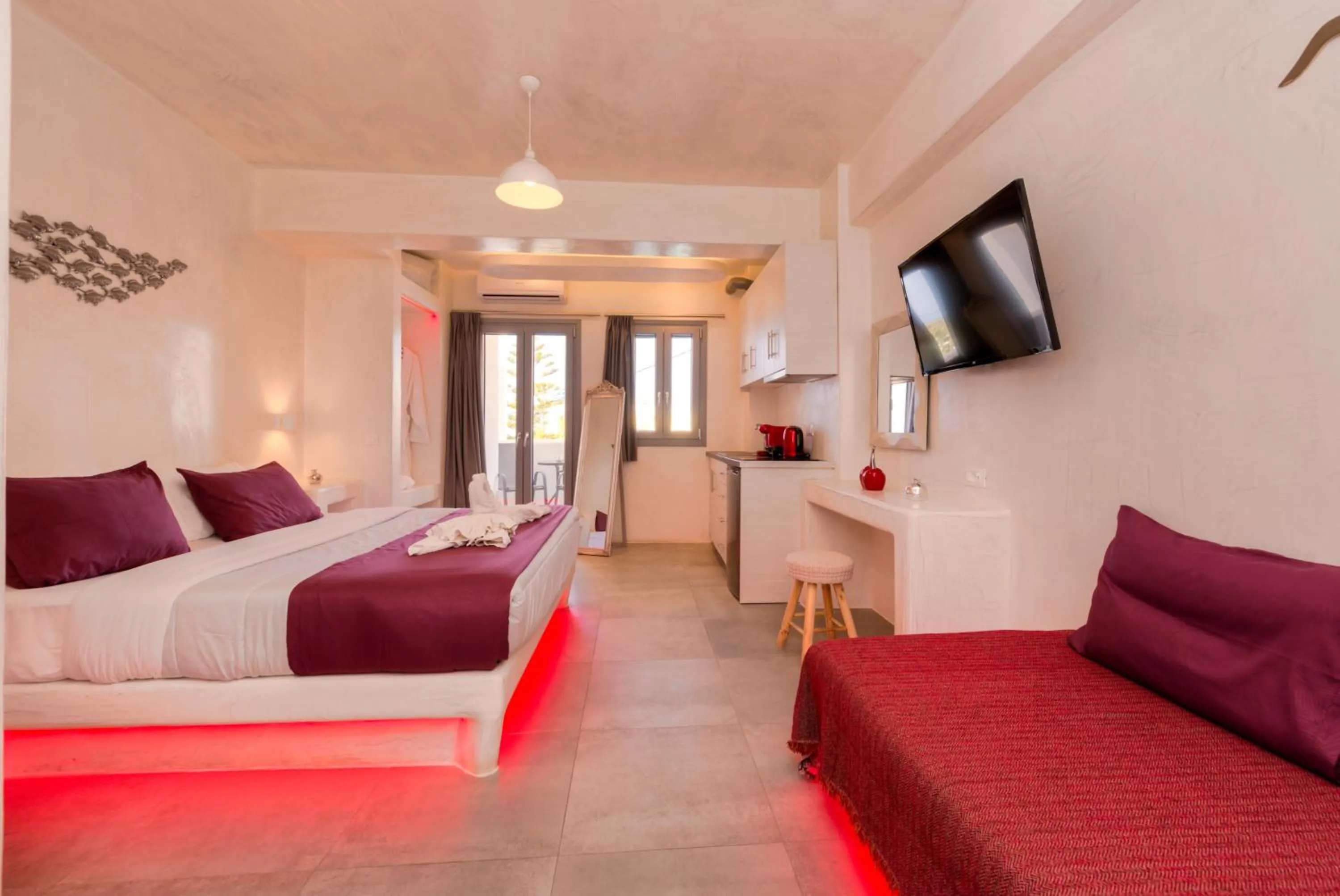 Photo of the whole room, Bed in The Muses of Santorini Private Jacuzzi Suites