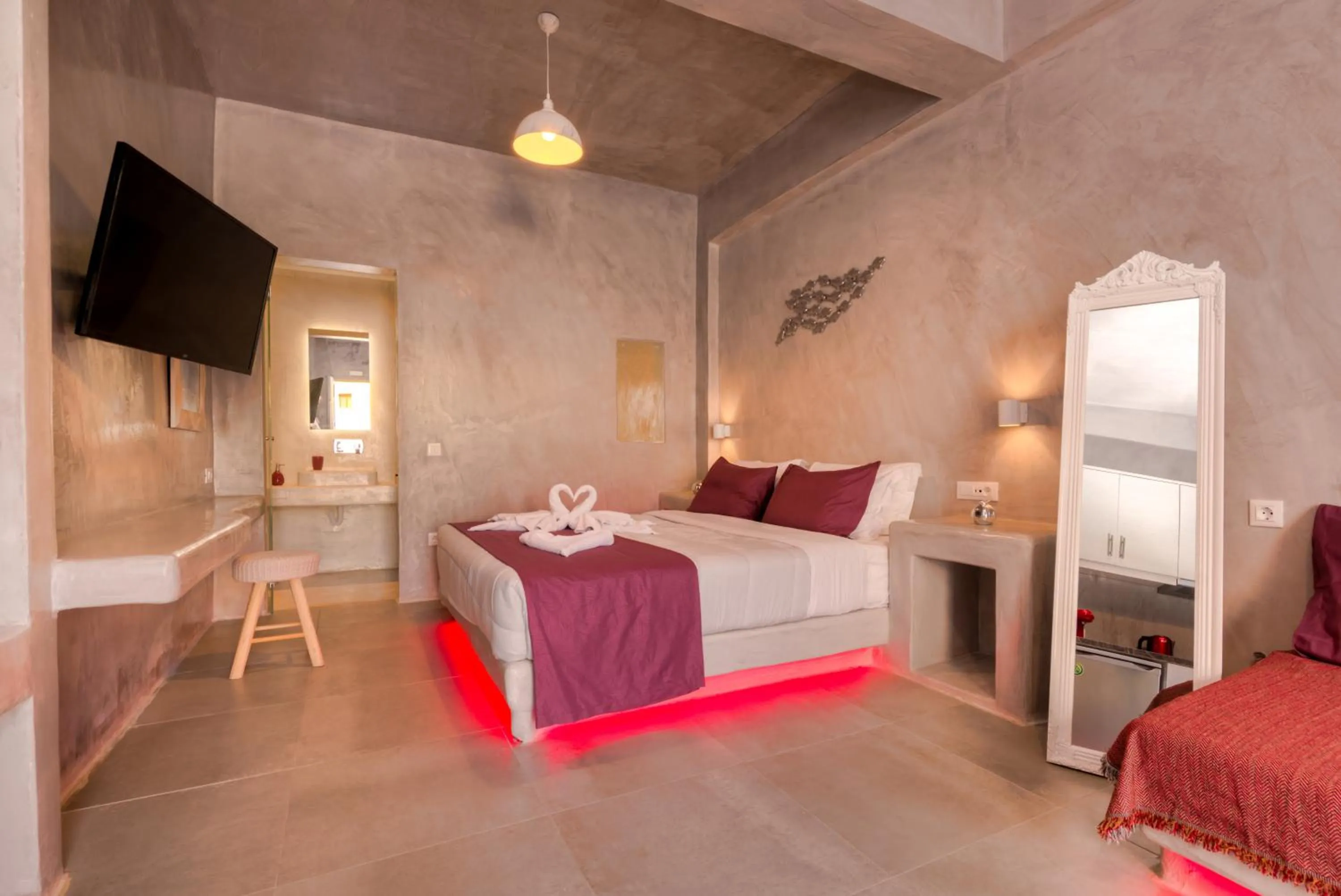 Photo of the whole room, Bed in The Muses of Santorini Private Jacuzzi Suites