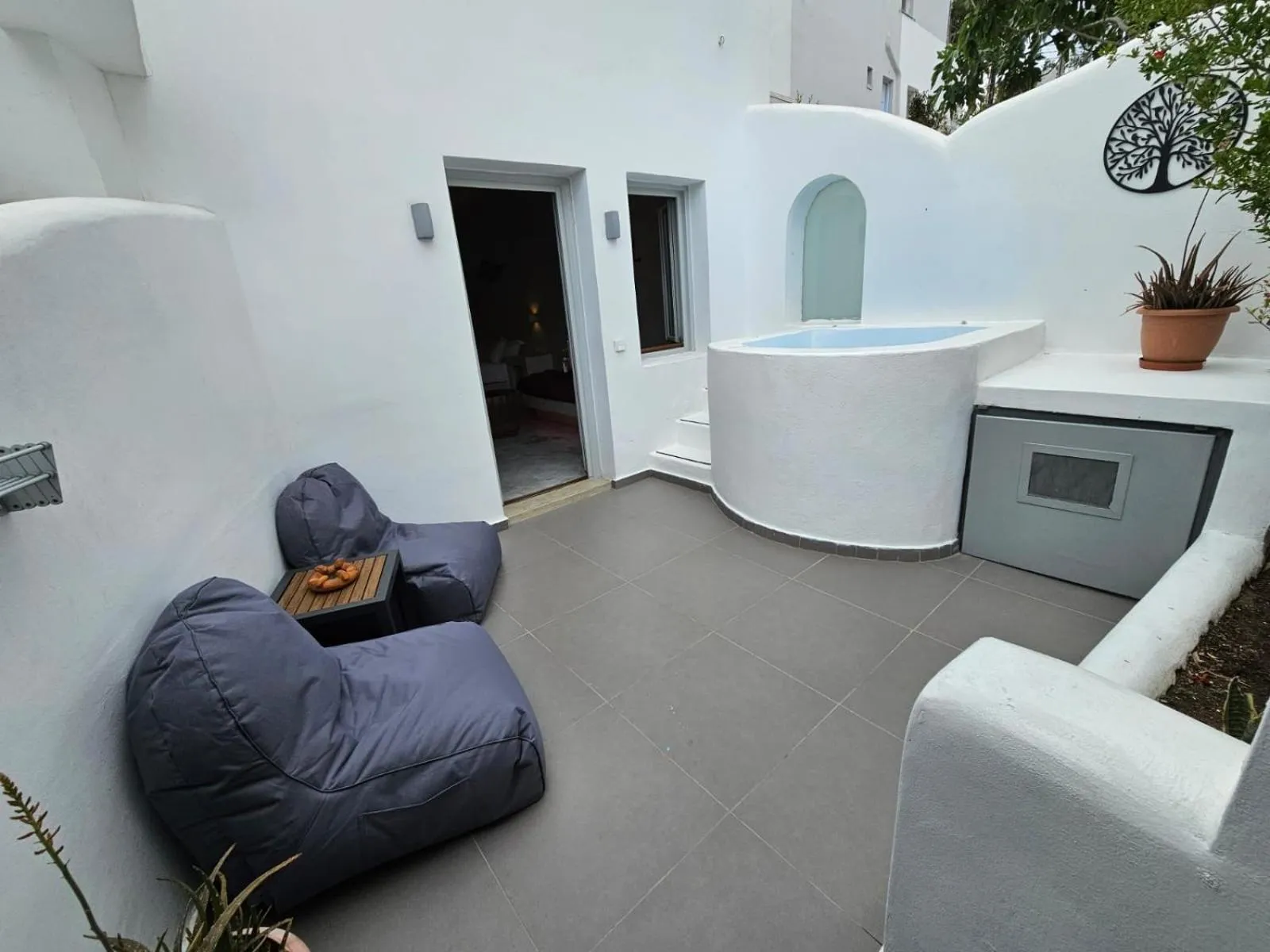 Inner courtyard view in The Muses of Santorini Private Jacuzzi Suites