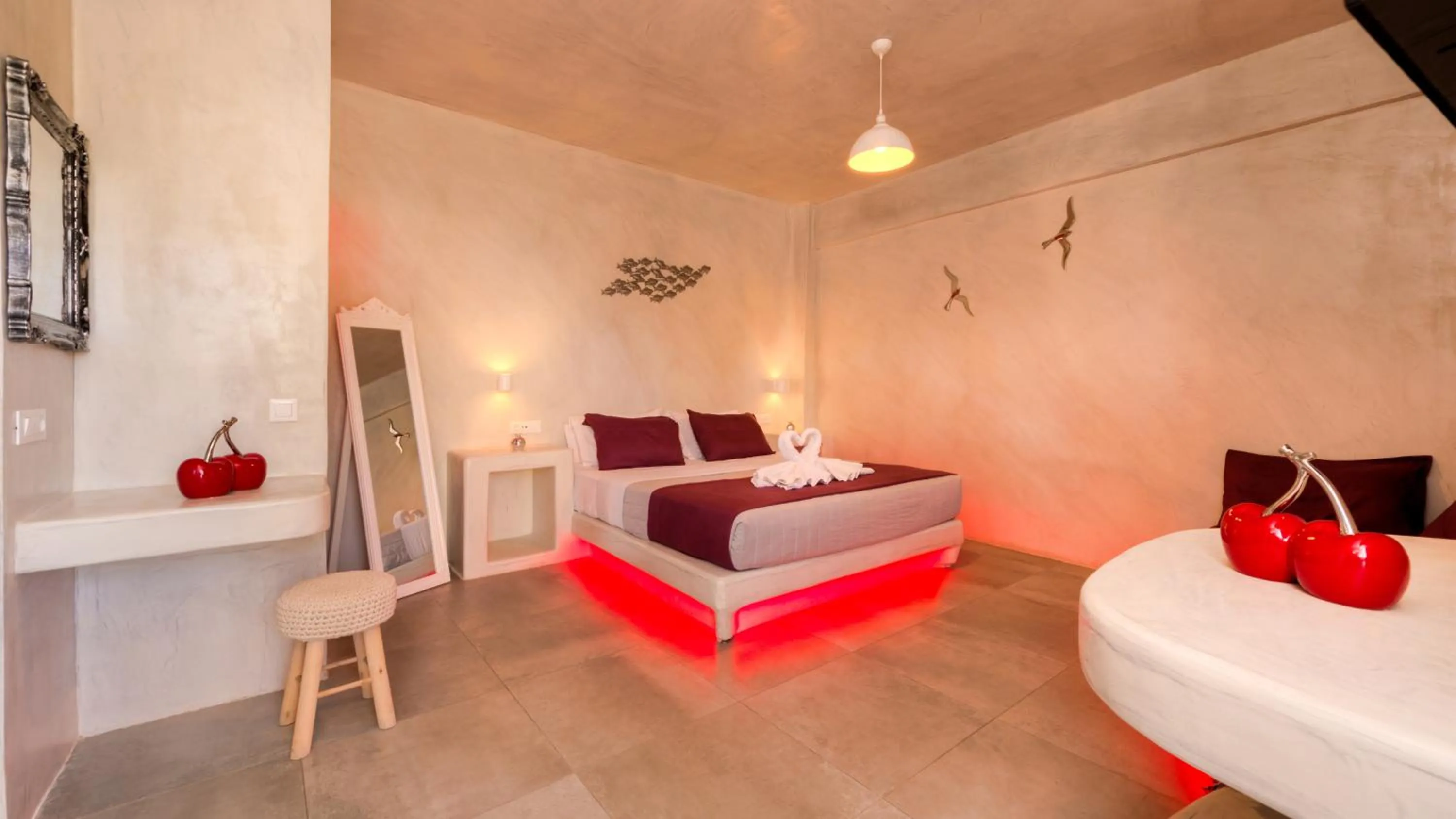 Bed in The Muses of Santorini Private Jacuzzi Suites