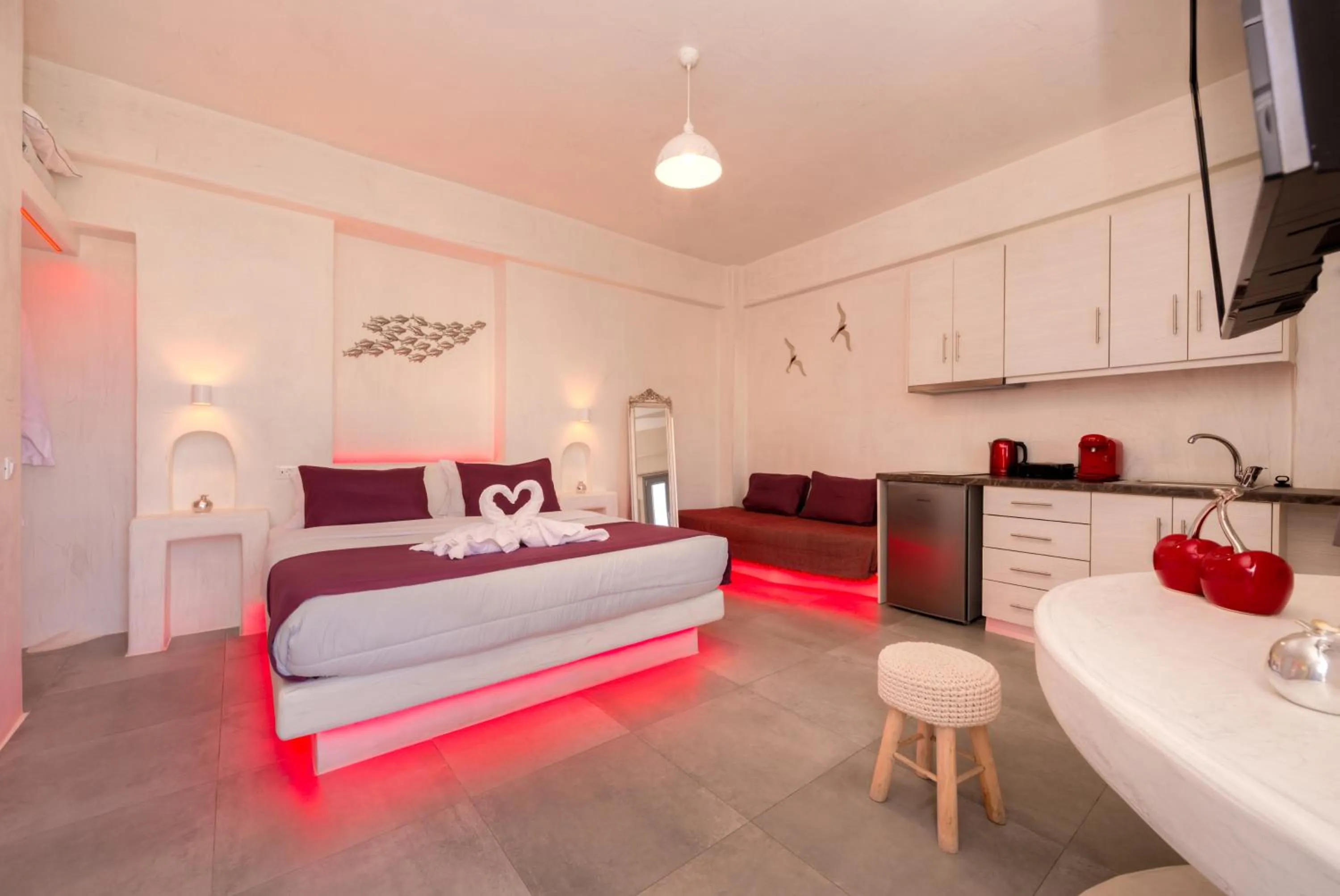 Photo of the whole room, Bed in The Muses of Santorini Private Jacuzzi Suites