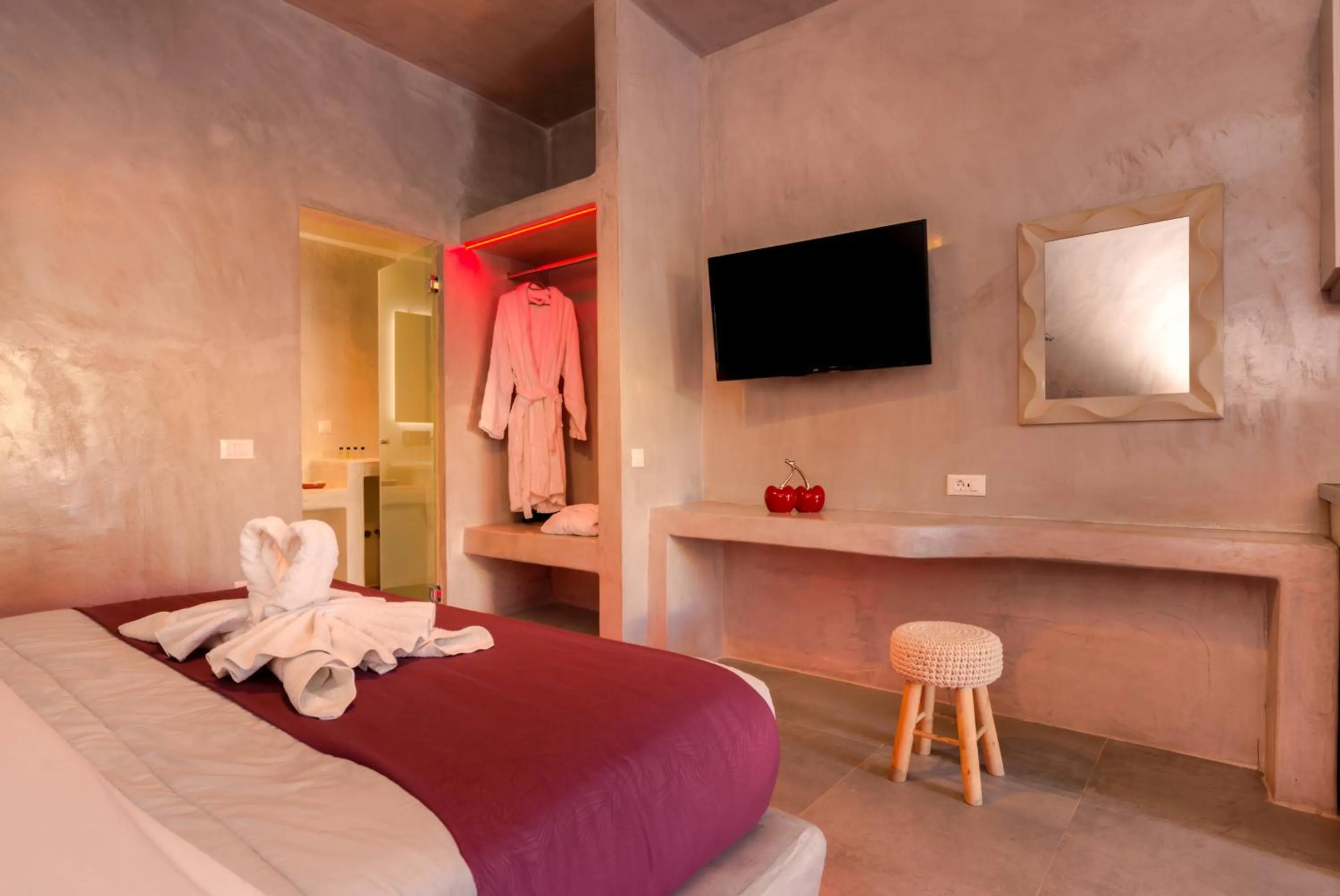 Photo of the whole room, Bed in The Muses of Santorini Private Jacuzzi Suites