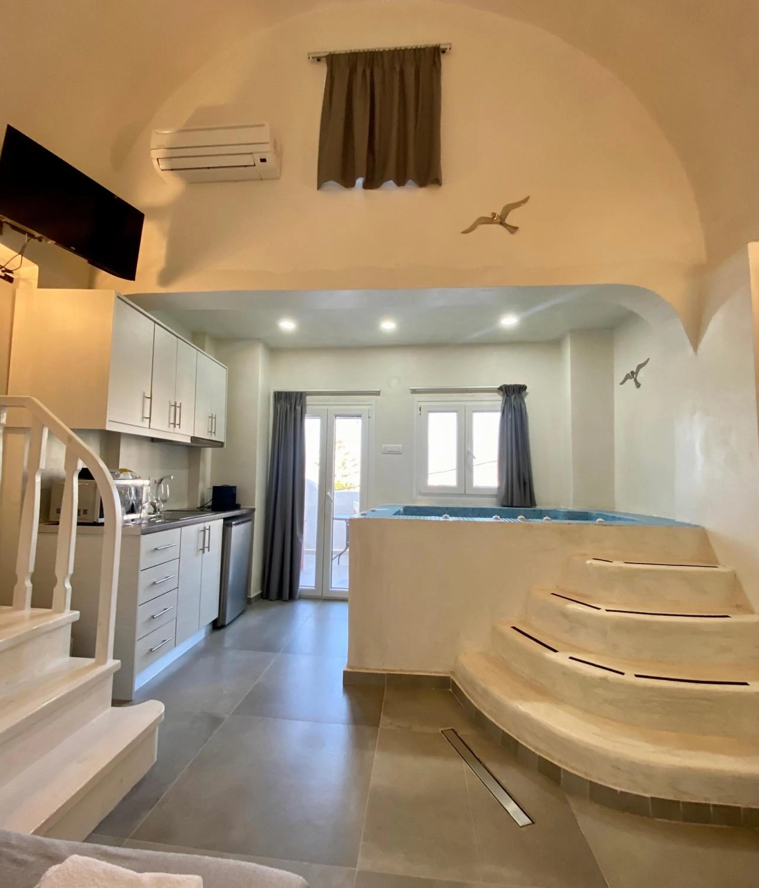 Photo of the whole room in The Muses of Santorini Private Jacuzzi Suites