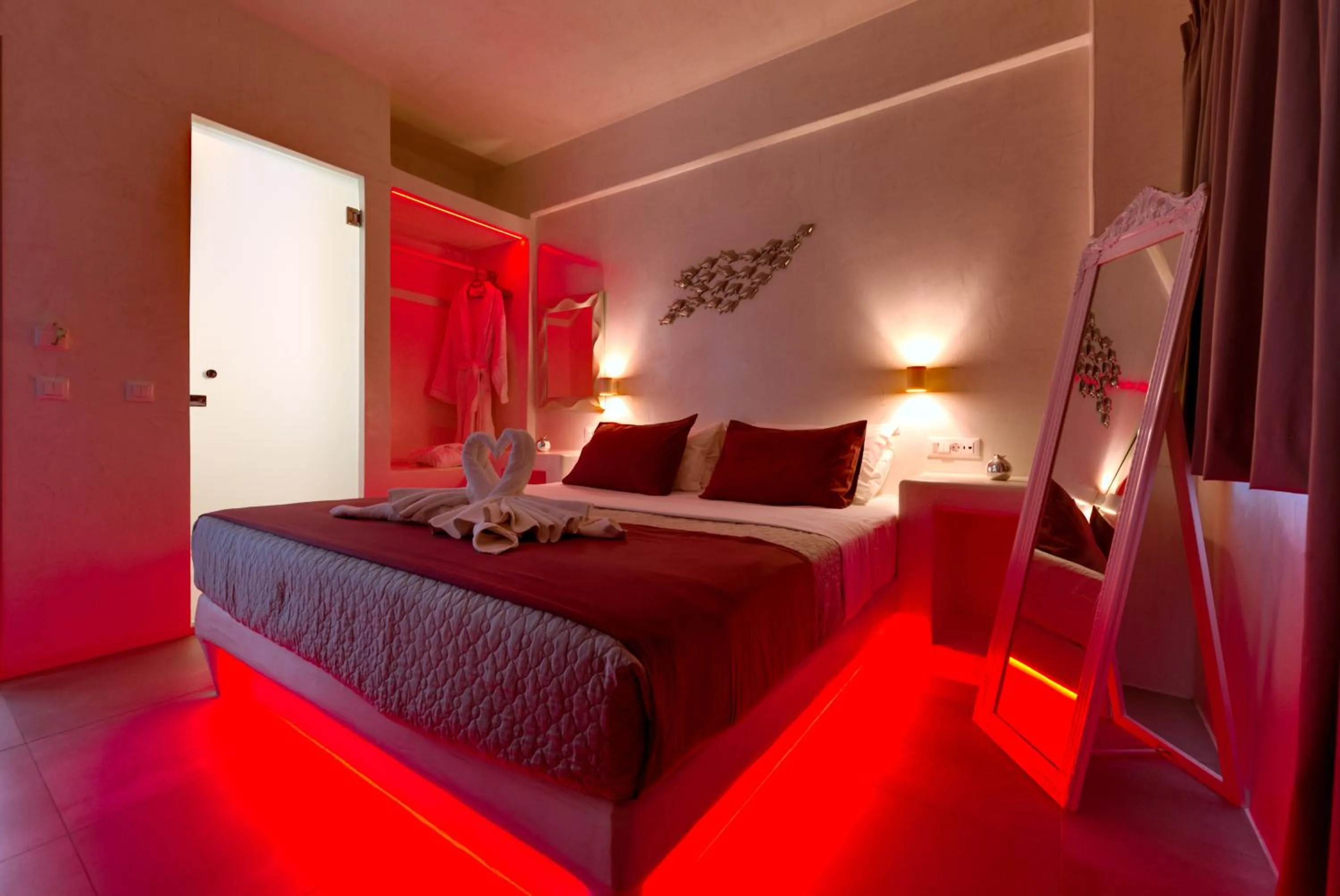 Bed in The Muses of Santorini Private Jacuzzi Suites