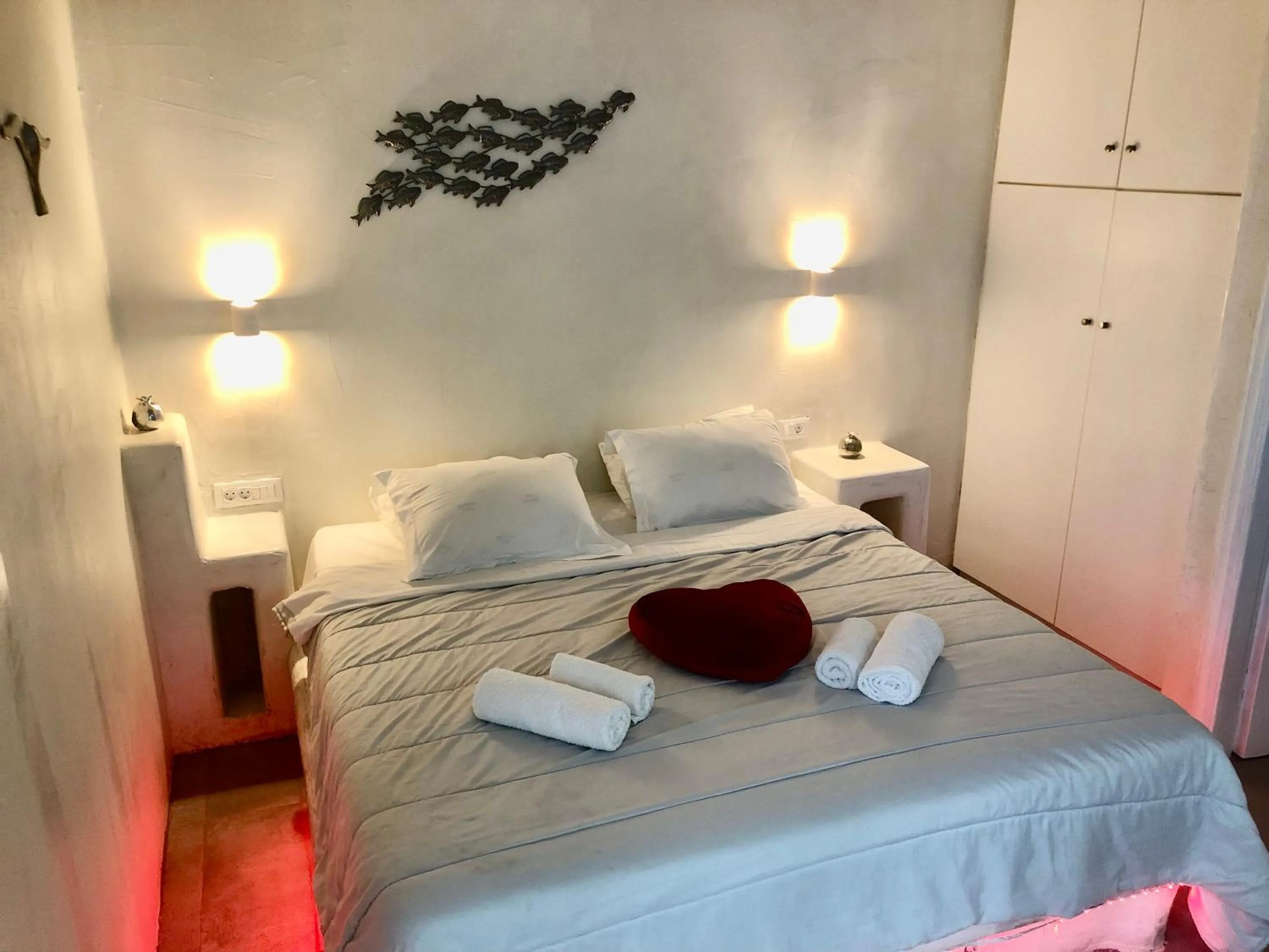 Bed in The Muses of Santorini Private Jacuzzi Suites