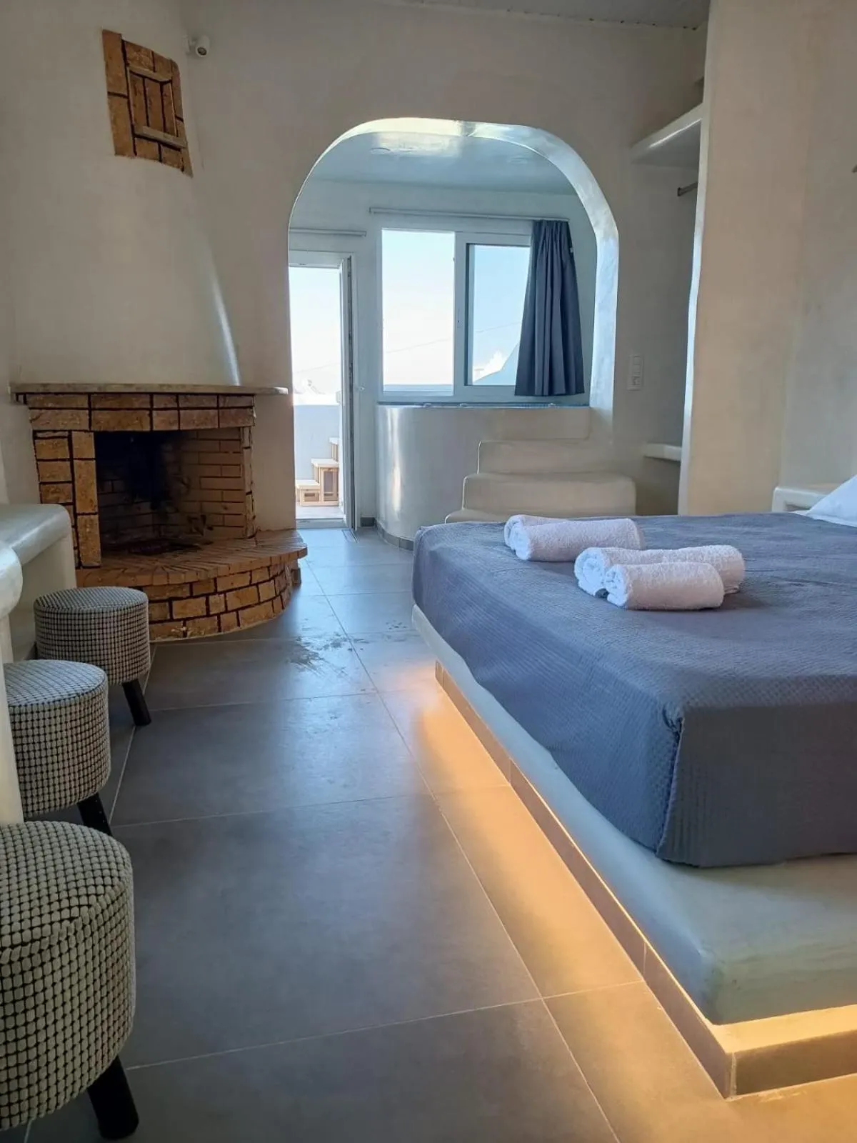 Photo of the whole room, Bed in The Muses of Santorini Private Jacuzzi Suites