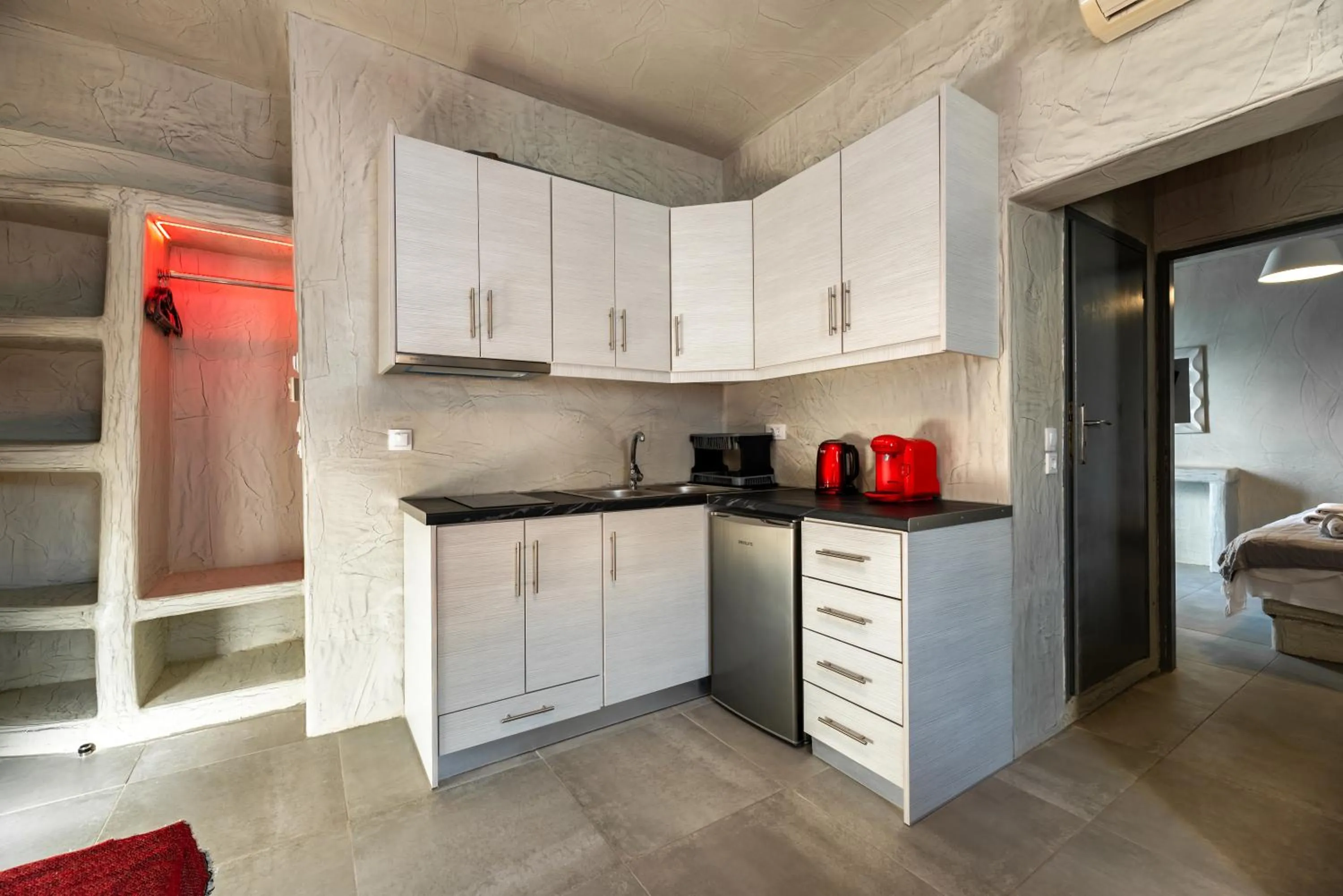 Kitchen or kitchenette in The Muses of Santorini Private Jacuzzi Suites