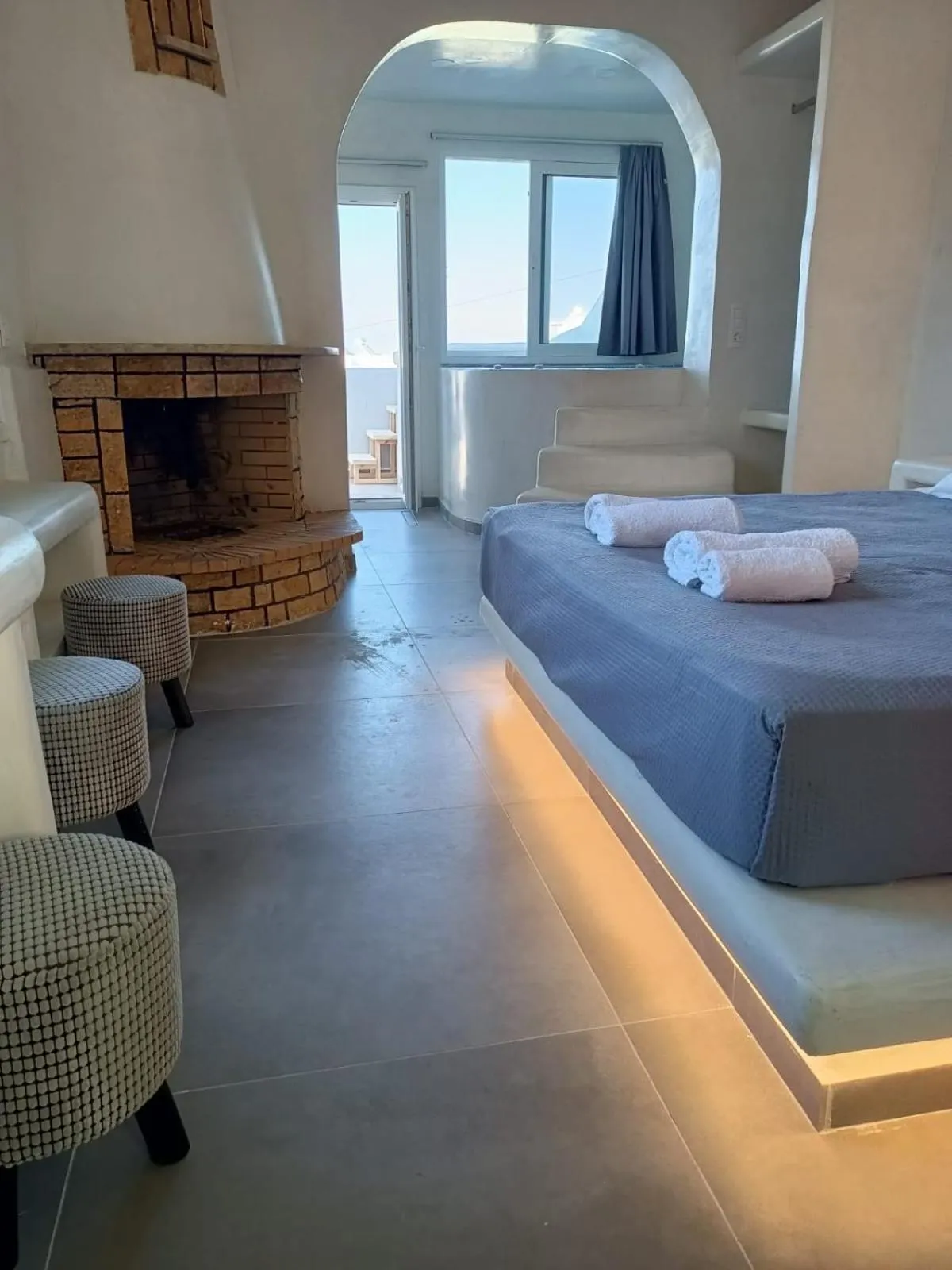 Photo of the whole room, Bed in The Muses of Santorini Private Jacuzzi Suites