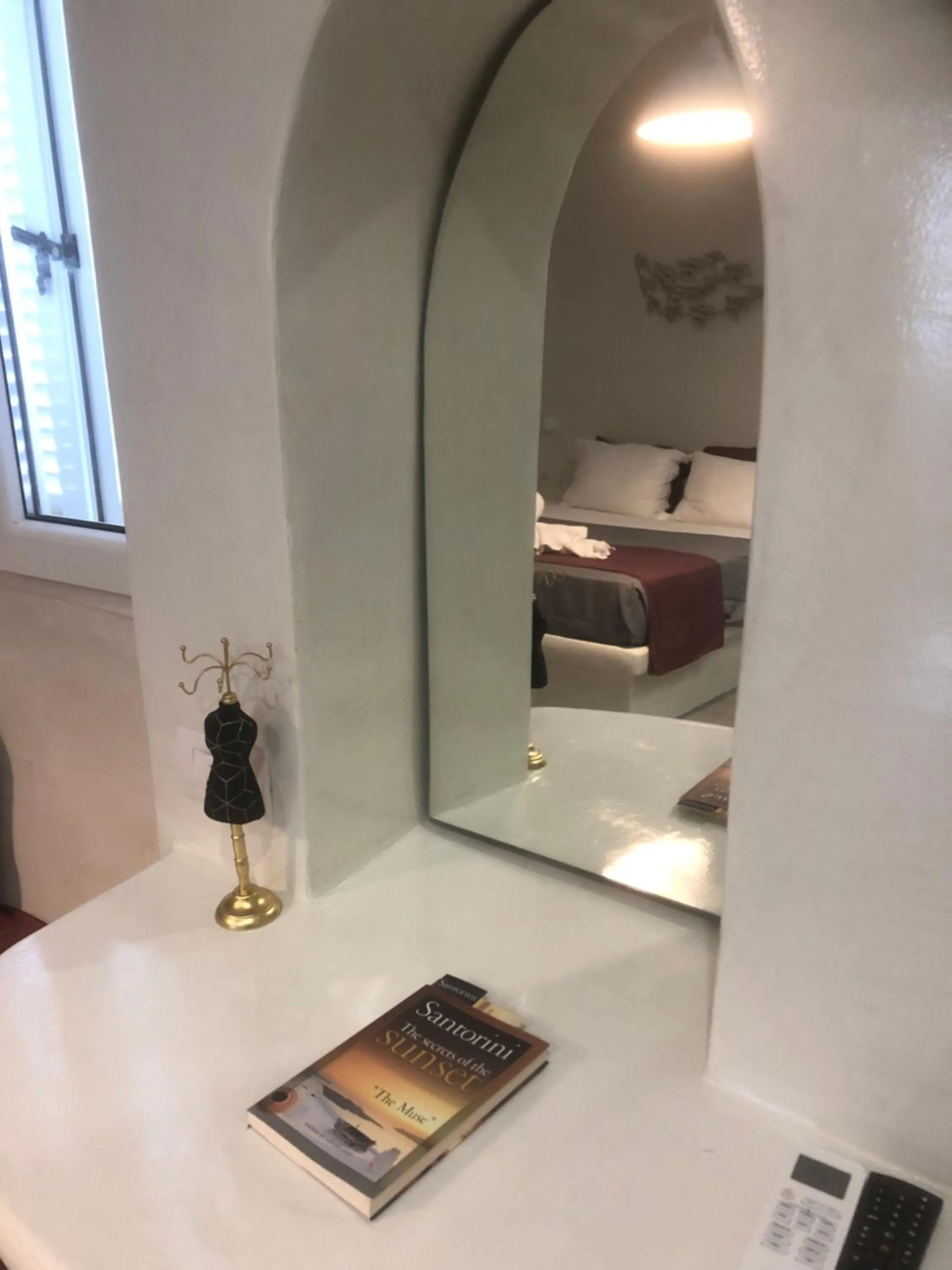 Seating area, Bed in The Muses of Santorini Private Jacuzzi Suites