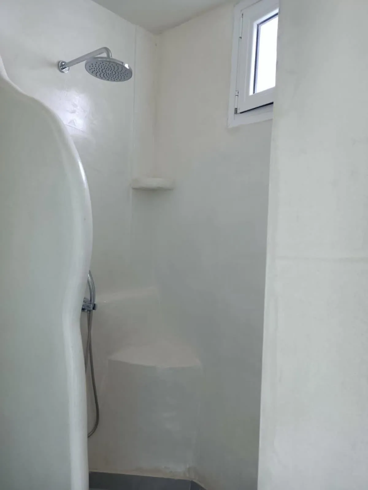 Shower in The Muses of Santorini Private Jacuzzi Suites