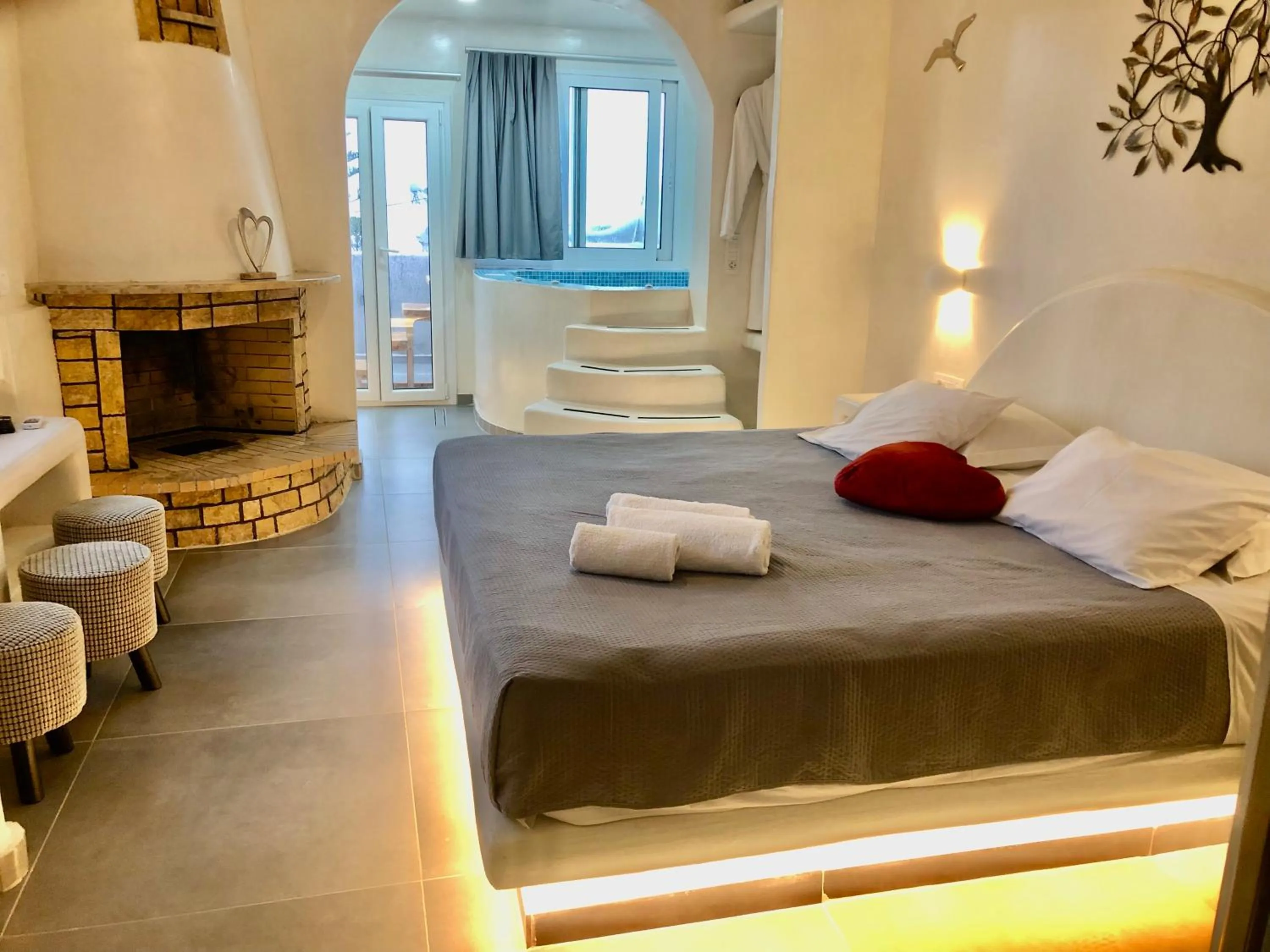 Photo of the whole room, Bed in The Muses of Santorini Private Jacuzzi Suites