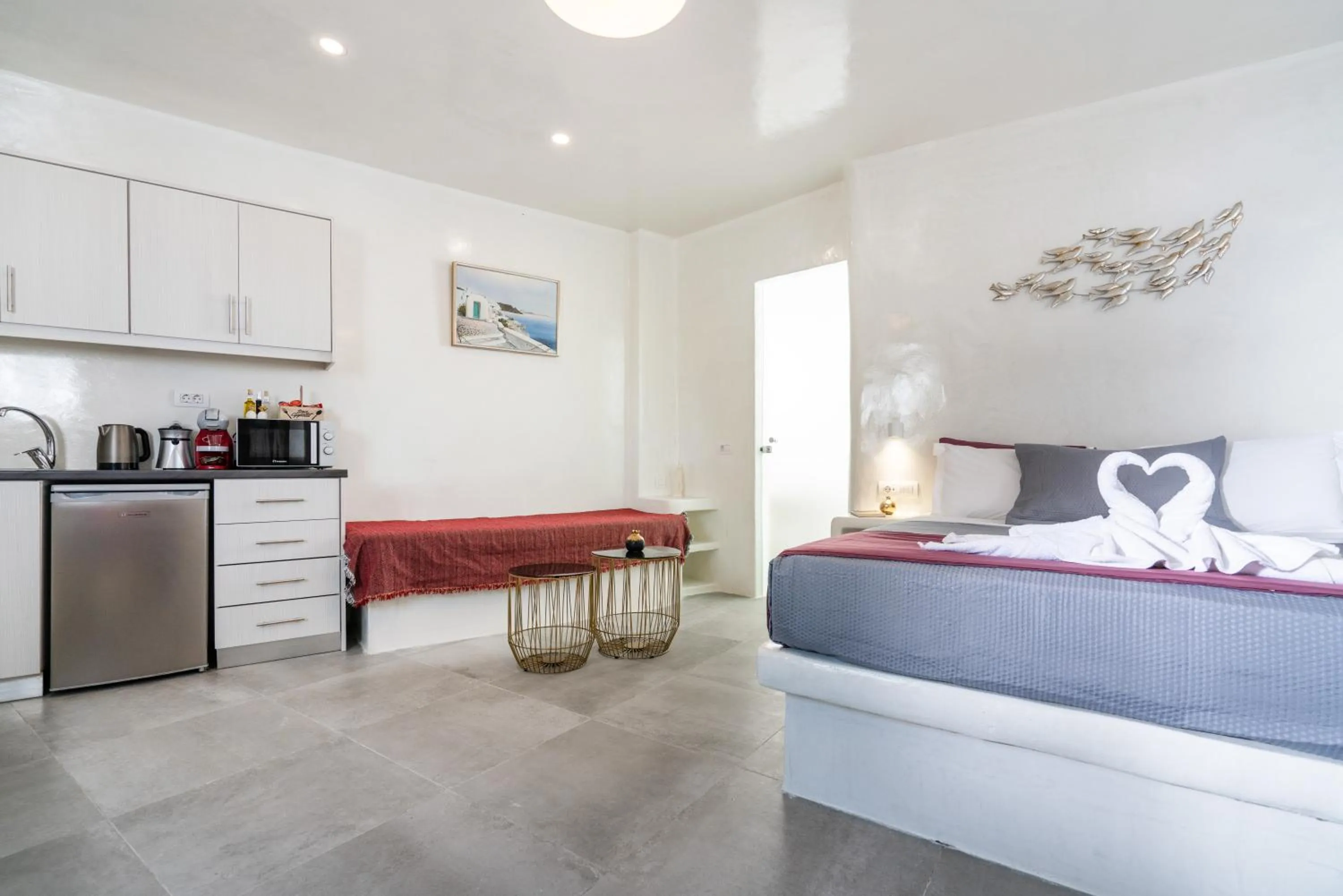 Kitchen or kitchenette, Bed in The Muses of Santorini Private Jacuzzi Suites