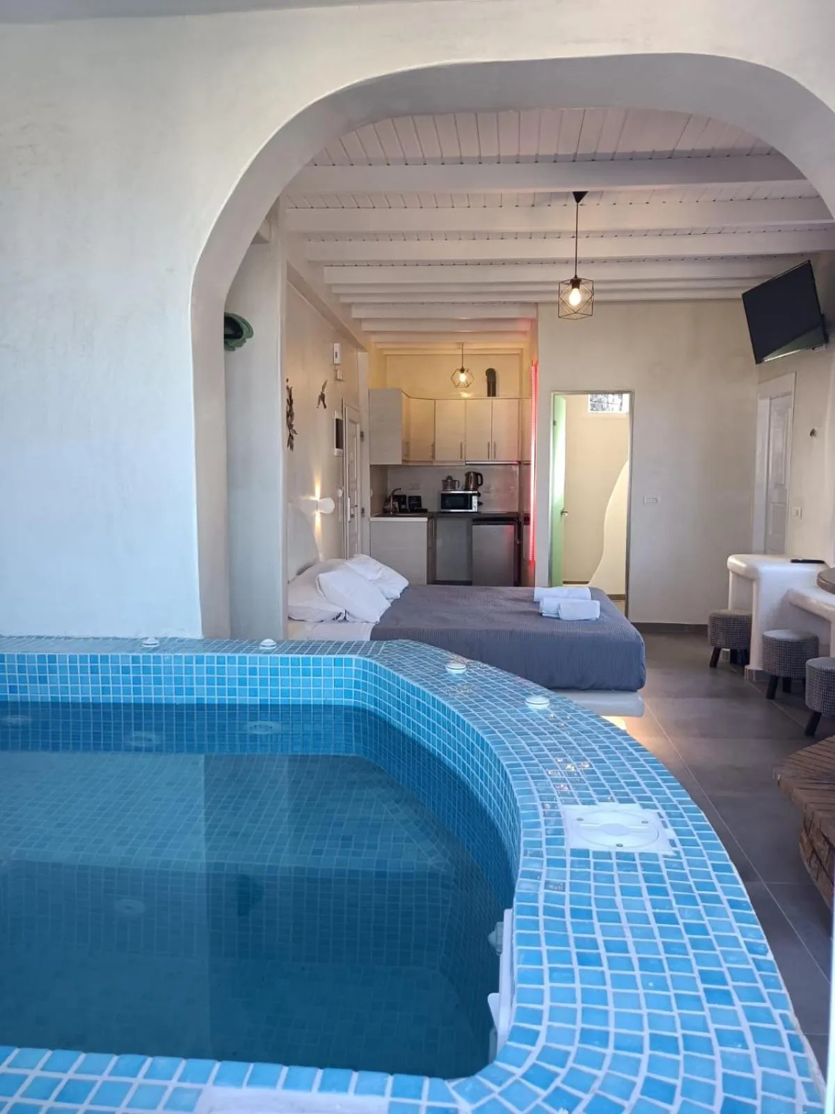 Photo of the whole room in The Muses of Santorini Private Jacuzzi Suites