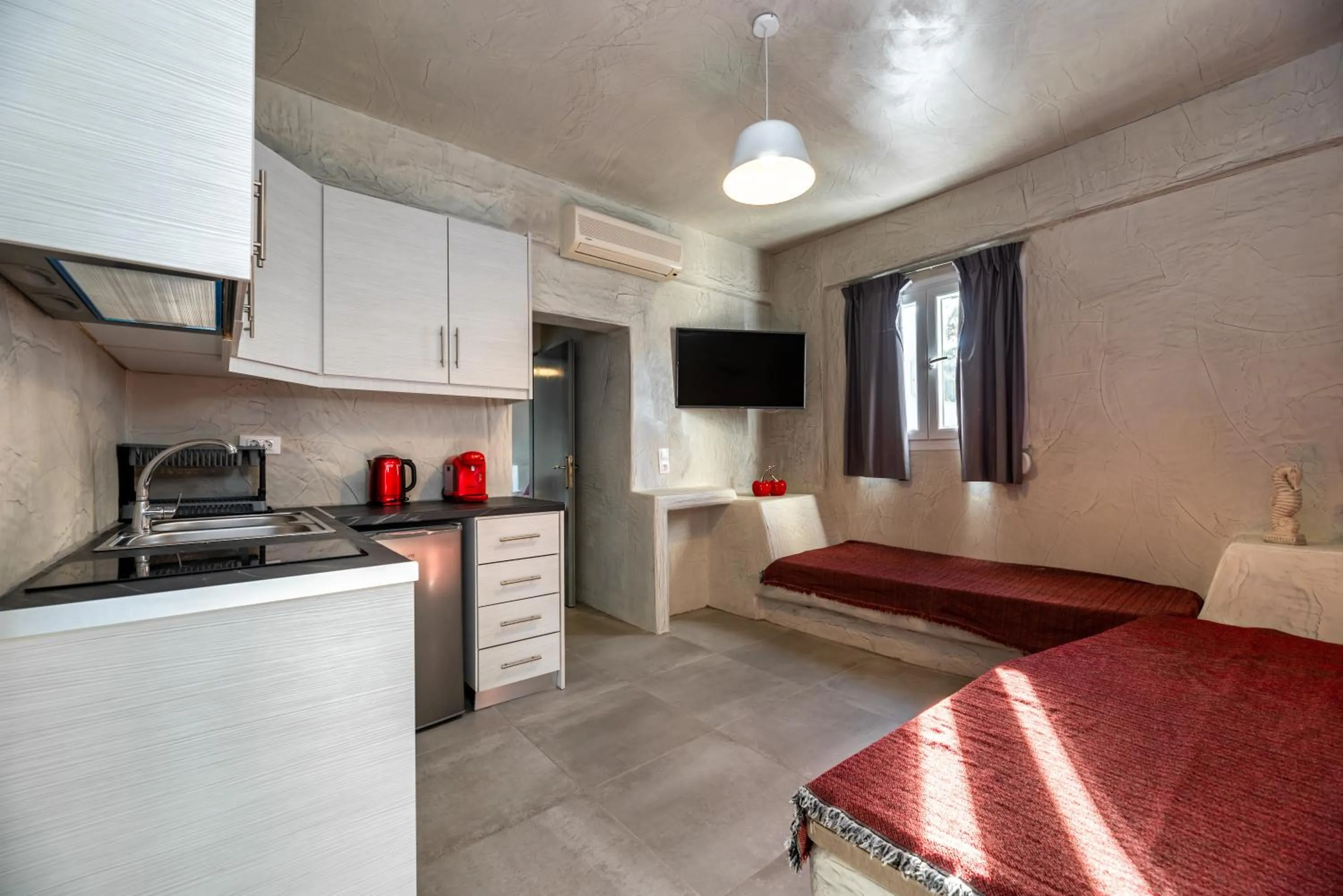 Kitchen or kitchenette in The Muses of Santorini Private Jacuzzi Suites