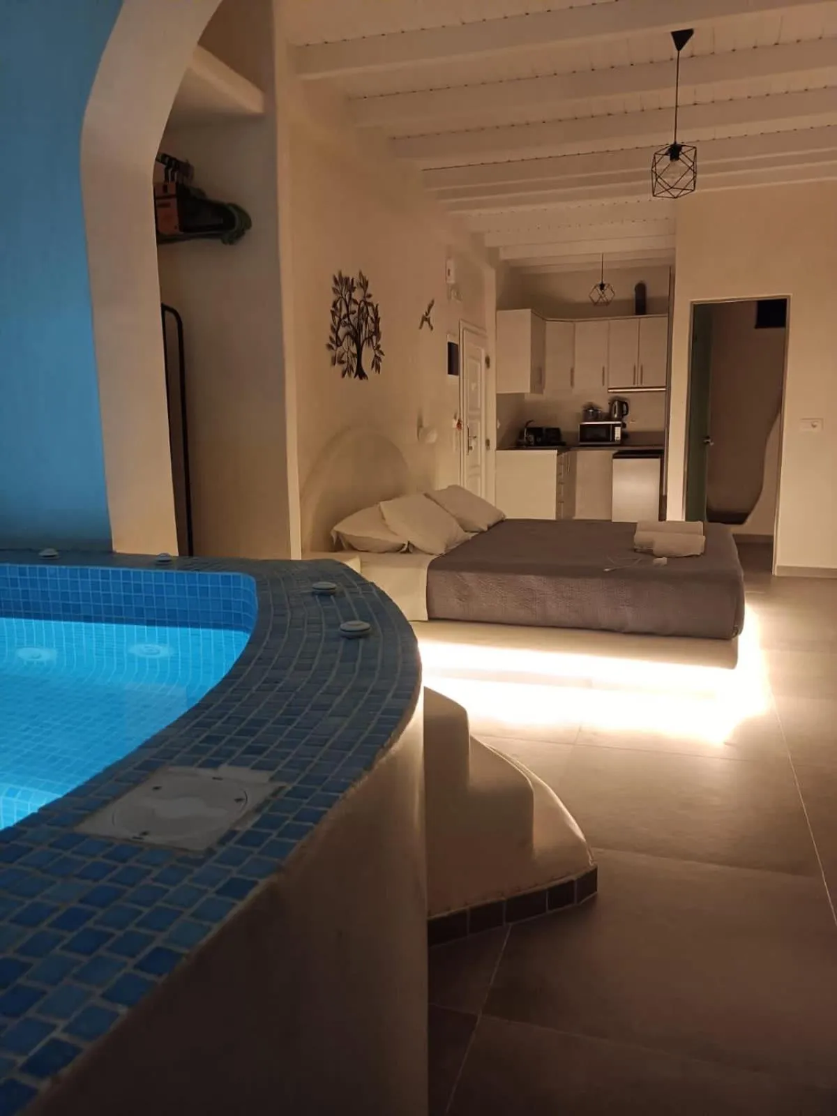 Bedroom in The Muses of Santorini Private Jacuzzi Suites