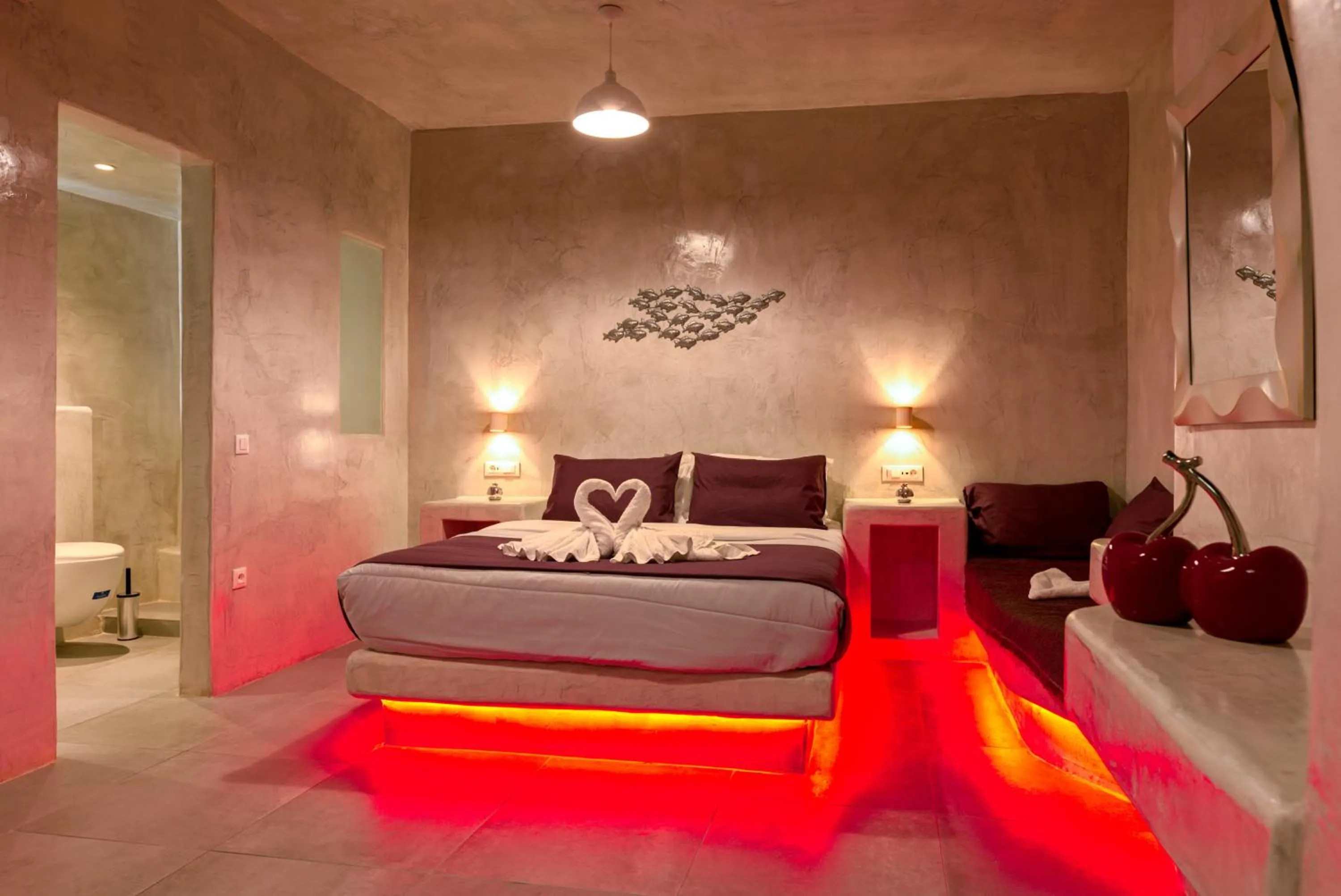 Bed in The Muses of Santorini Private Jacuzzi Suites