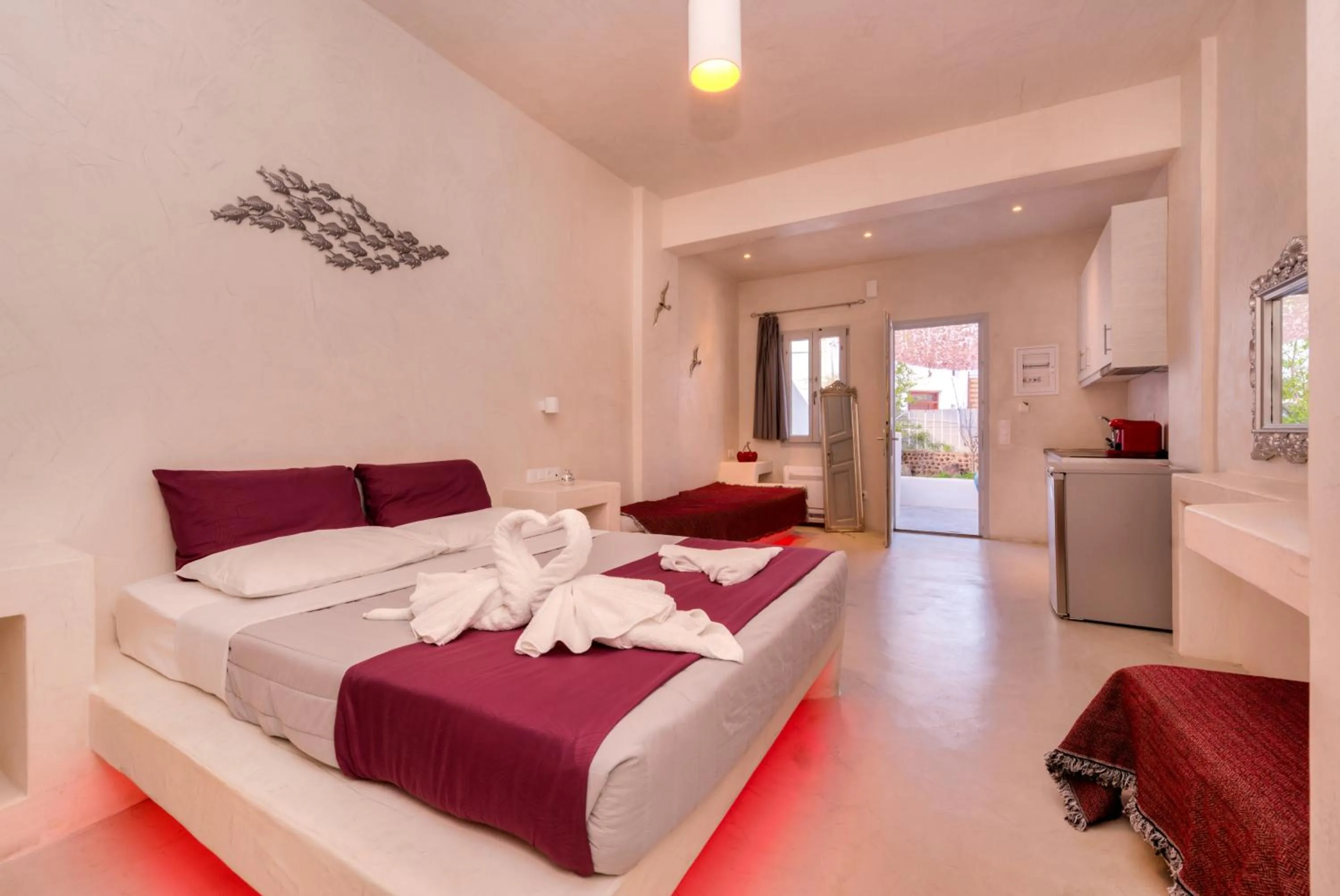 Photo of the whole room, Bed in The Muses of Santorini Private Jacuzzi Suites