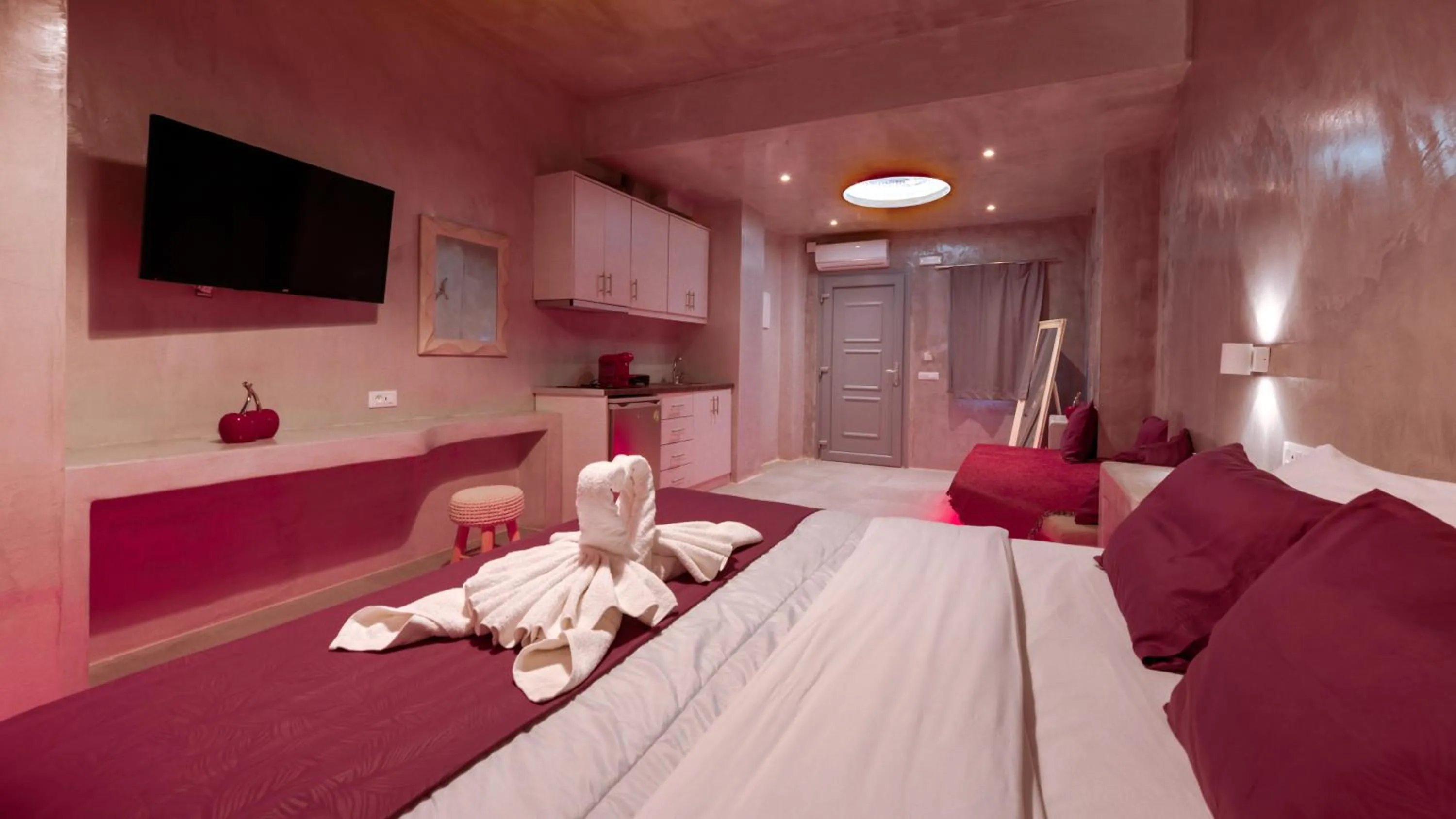 Photo of the whole room, Bed in The Muses of Santorini Private Jacuzzi Suites
