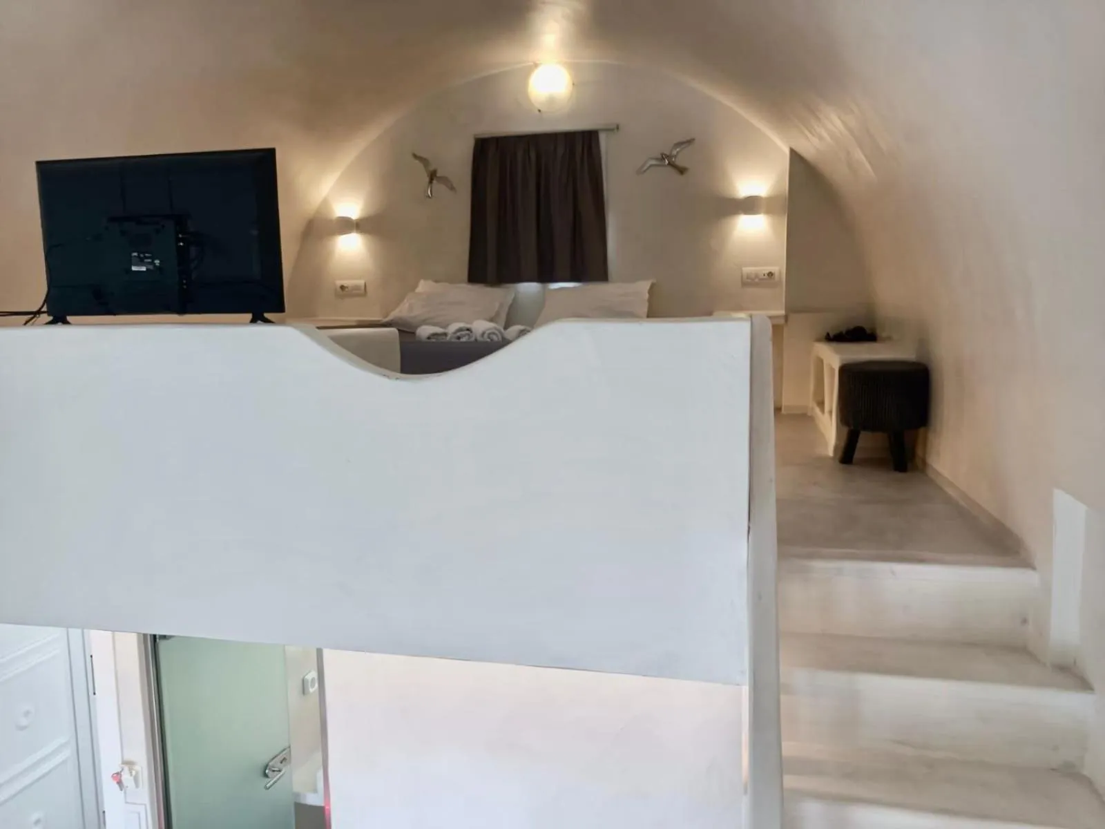 Bedroom in The Muses of Santorini Private Jacuzzi Suites