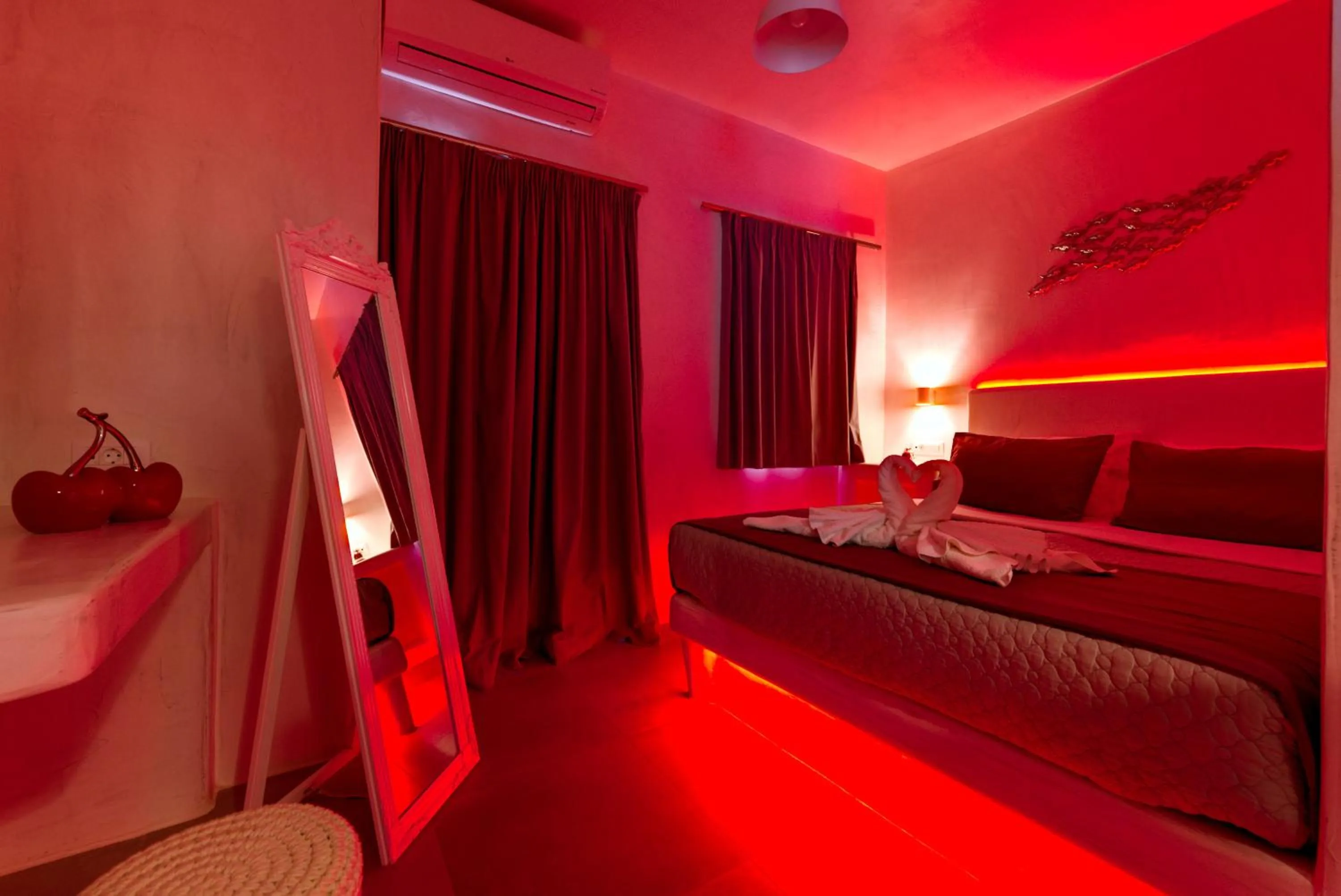 Photo of the whole room, Bed in The Muses of Santorini Private Jacuzzi Suites