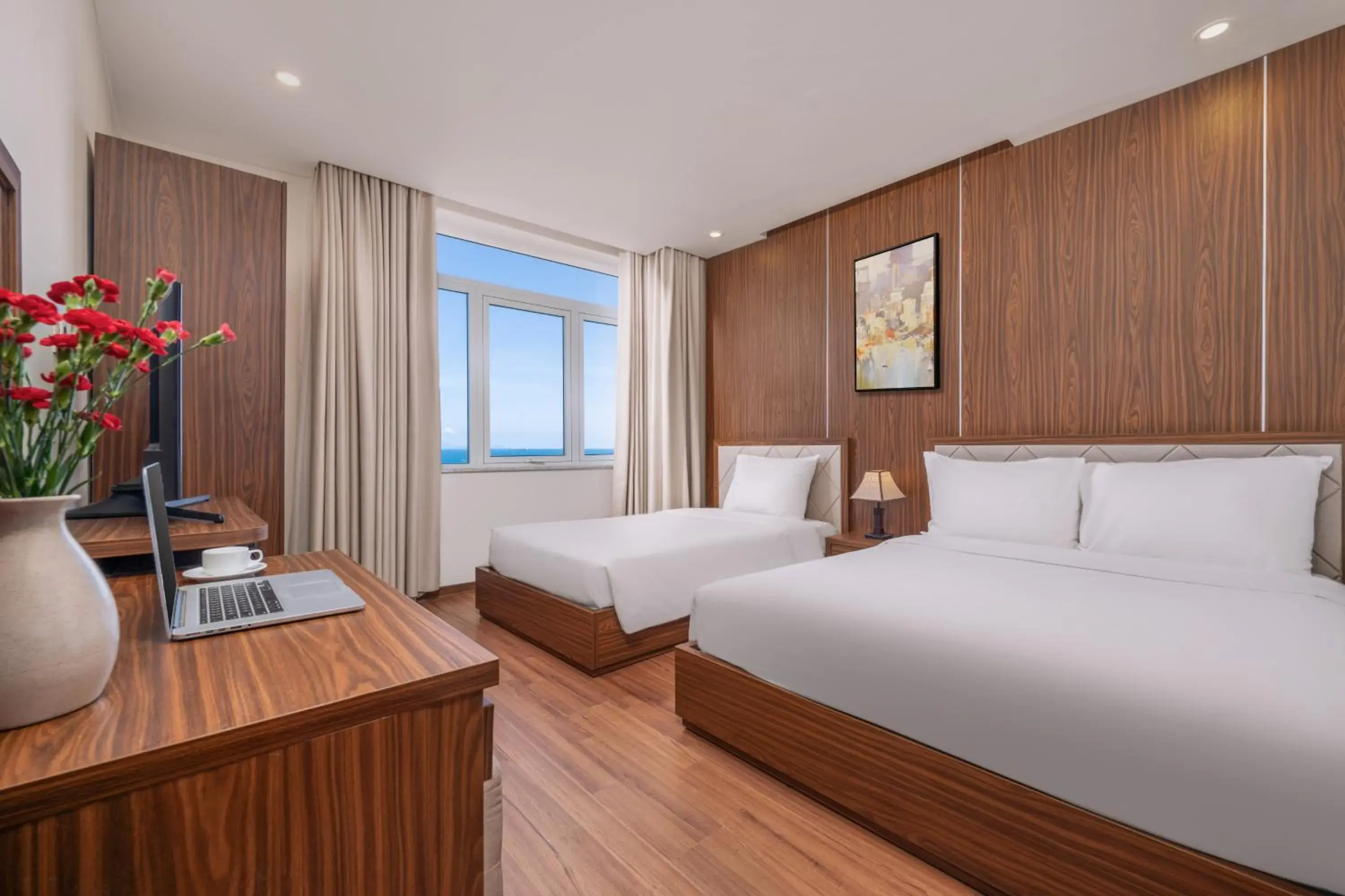 Deluxe Triple Room with Sea View in De Lamour Hotel Da Nang Deluxe Triple Room with Sea View in De Lamour Hotel Da Nang