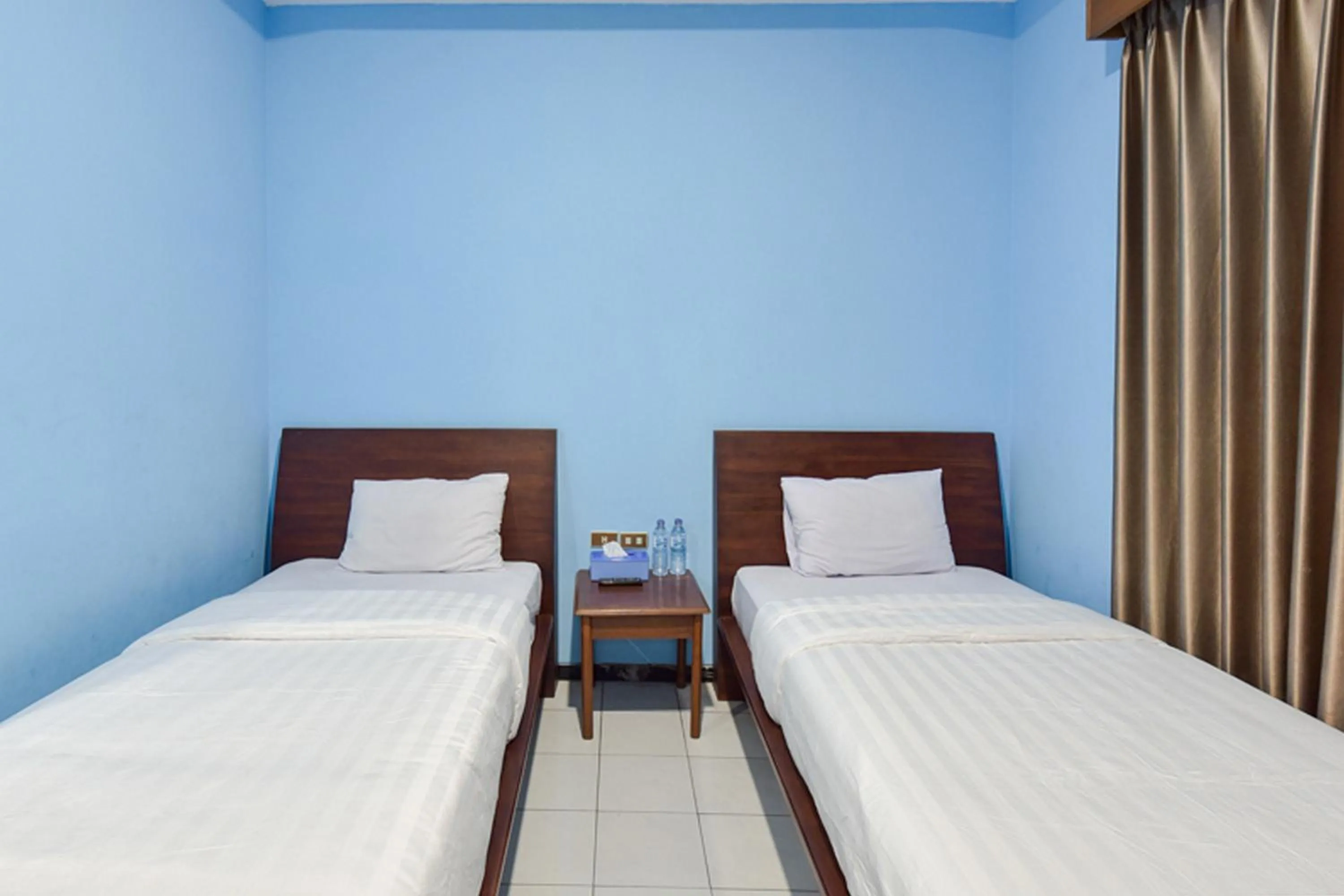 Bed in Sekar Ayu Hotel Malioboro Mitra RedDoorz