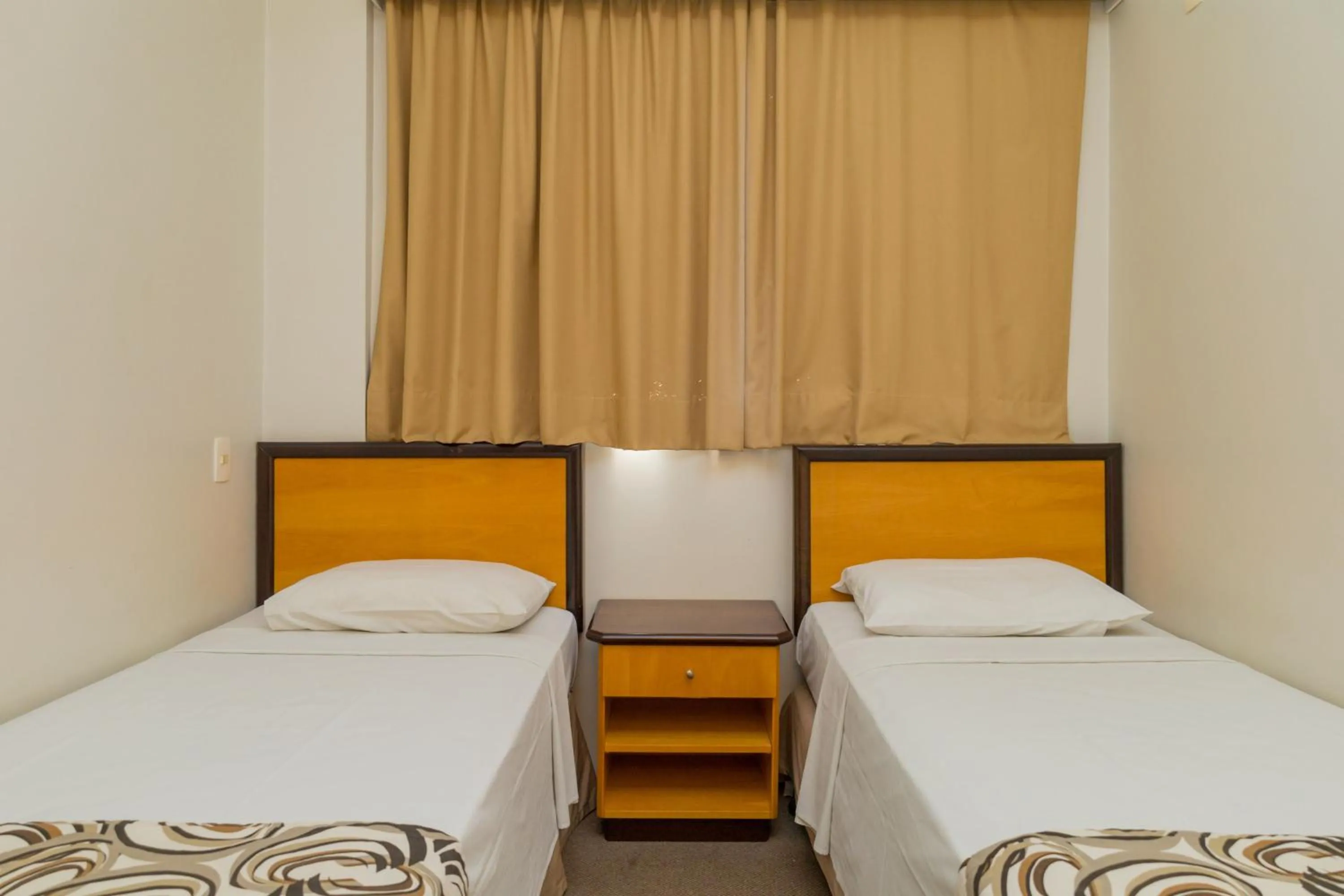 Bed in Golden Suíte Hotel