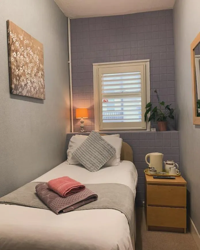 Bed in Relax Inn Guest House