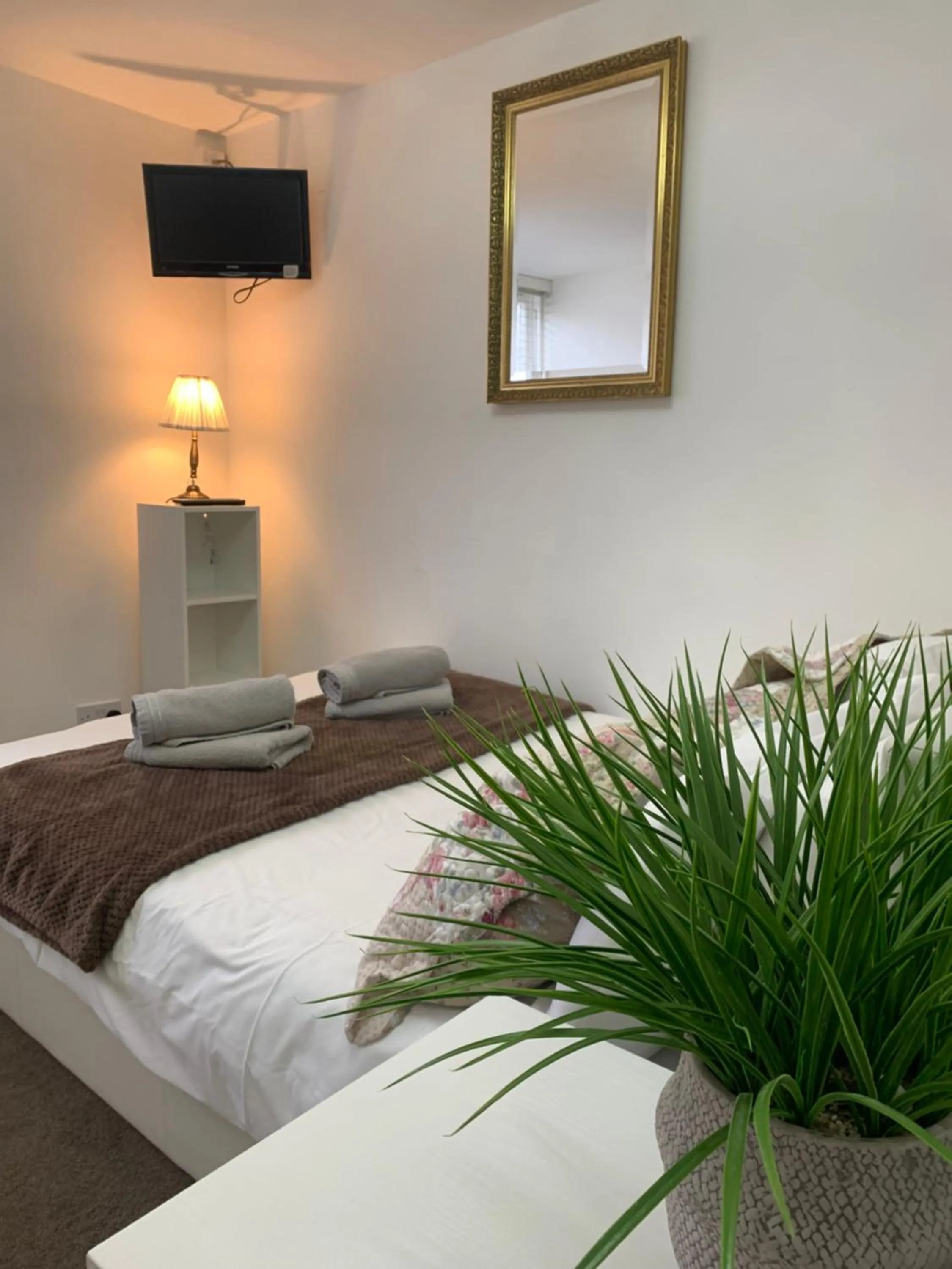 Bed in Relax Inn Guest House