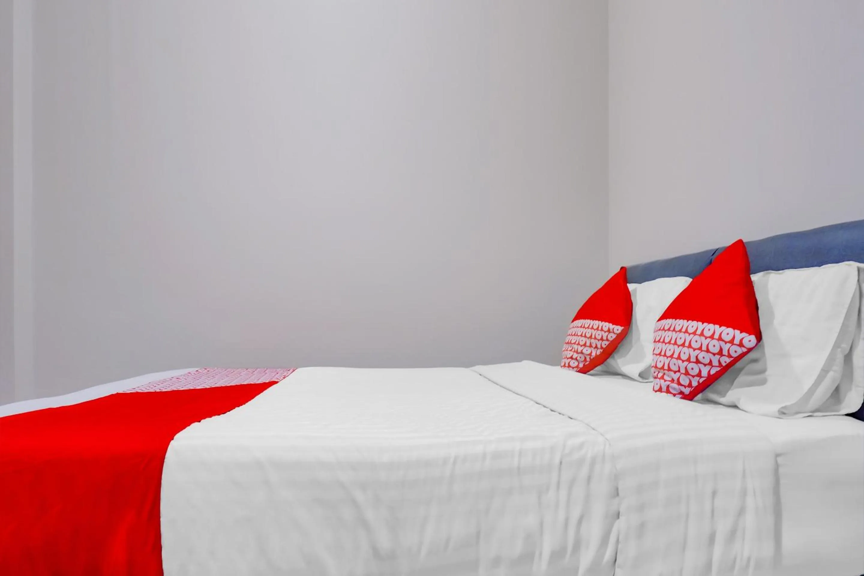 Bed in OYO 117 Blueberry Homestay