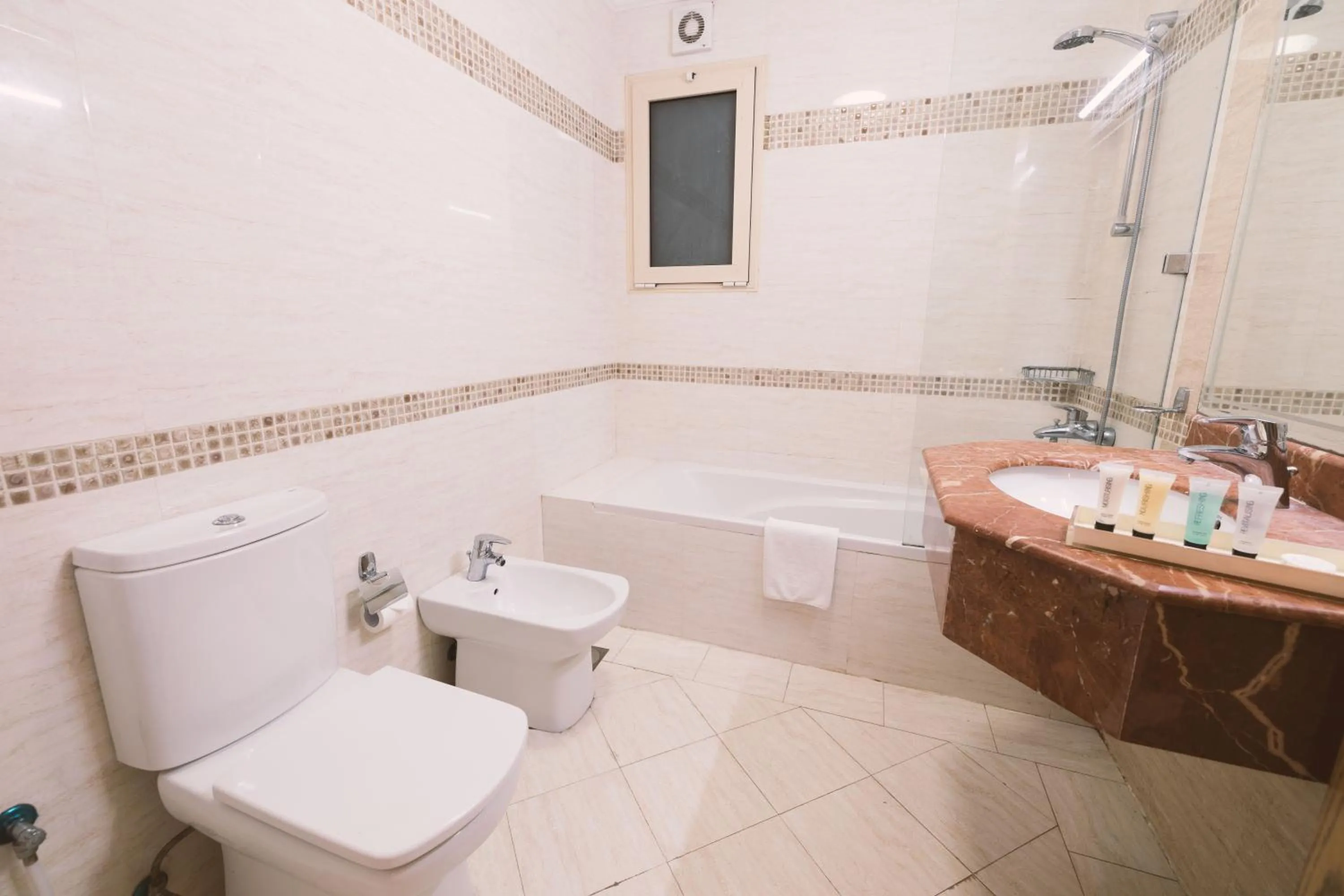 Bathroom in Magnum Hotel & Suites West Bay