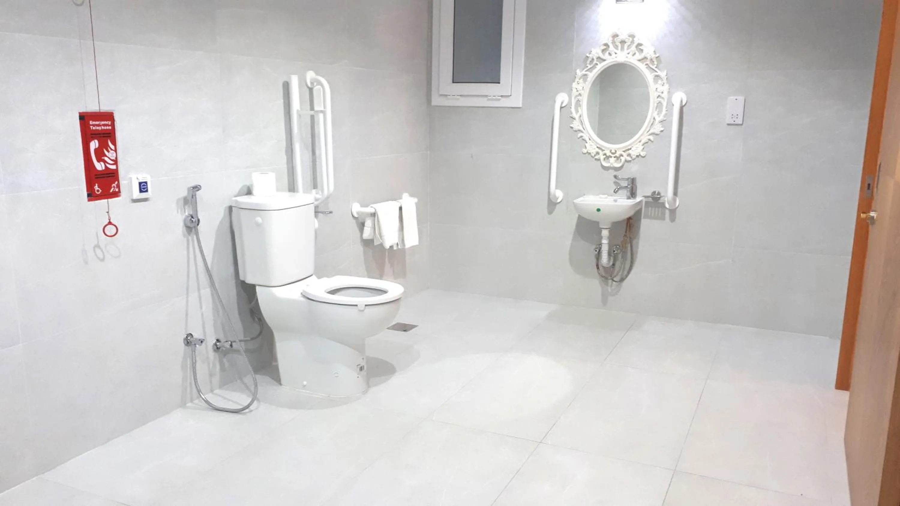 Bathroom in Magnum Hotel & Suites West Bay