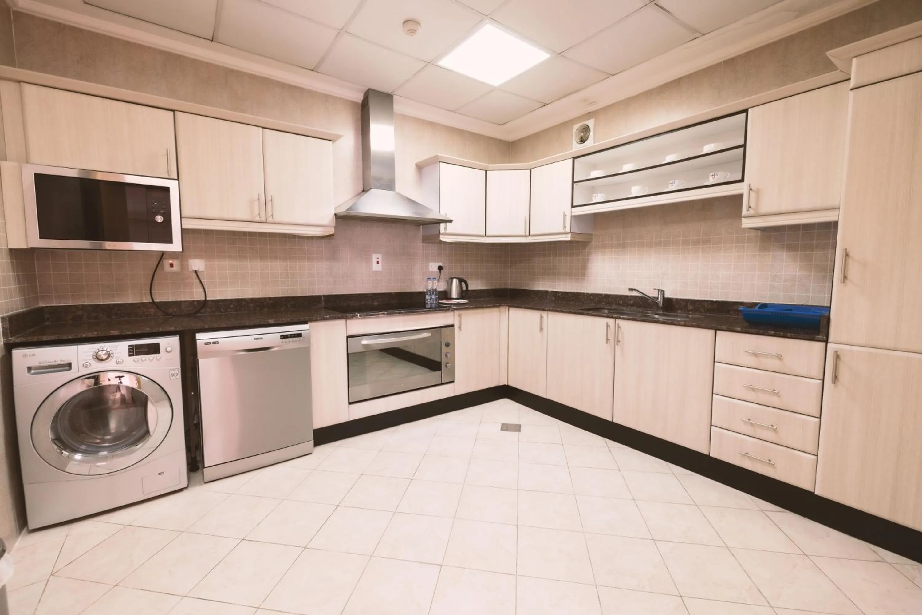 Kitchen or kitchenette in Magnum Hotel & Suites West Bay