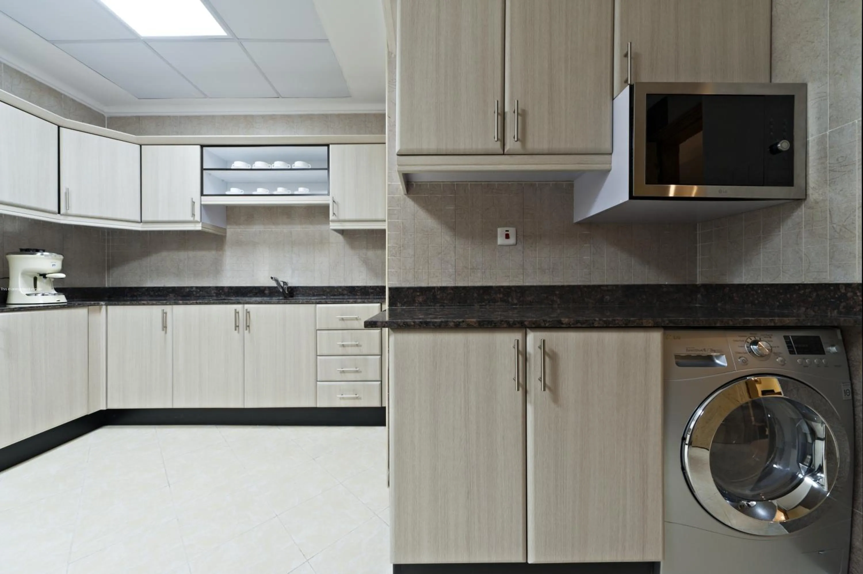 Kitchen or kitchenette in Magnum Hotel & Suites West Bay