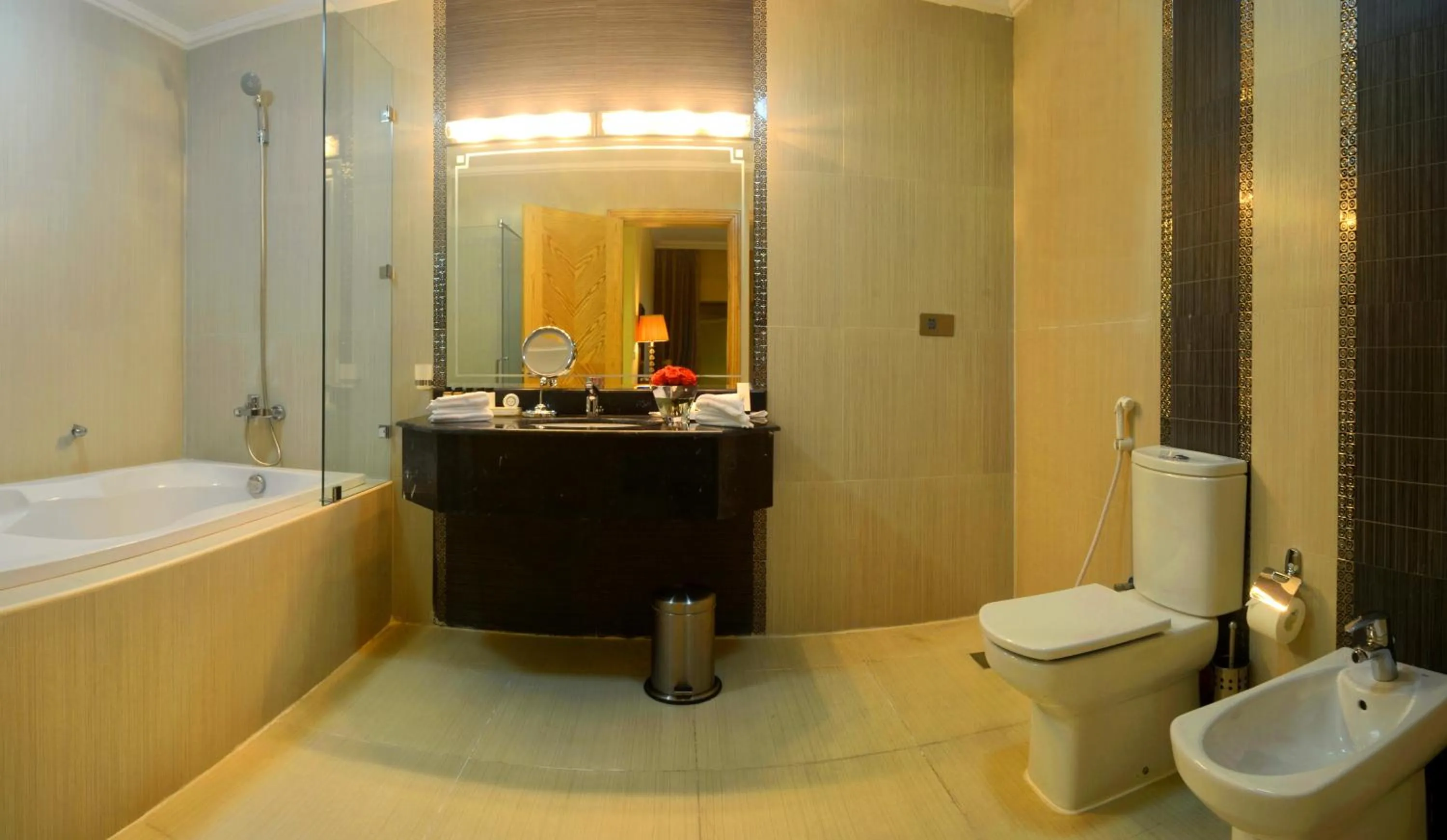 Toilet in Magnum Hotel & Suites West Bay