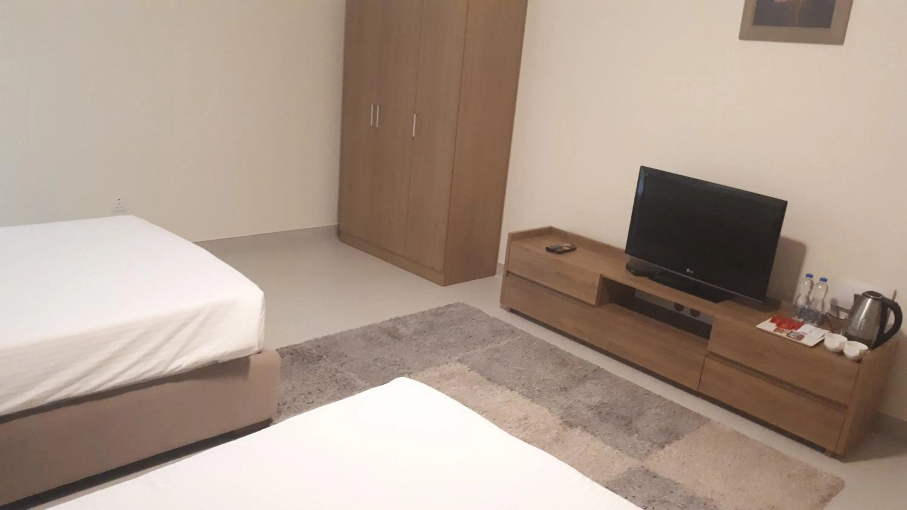 Bedroom in Magnum Hotel & Suites West Bay