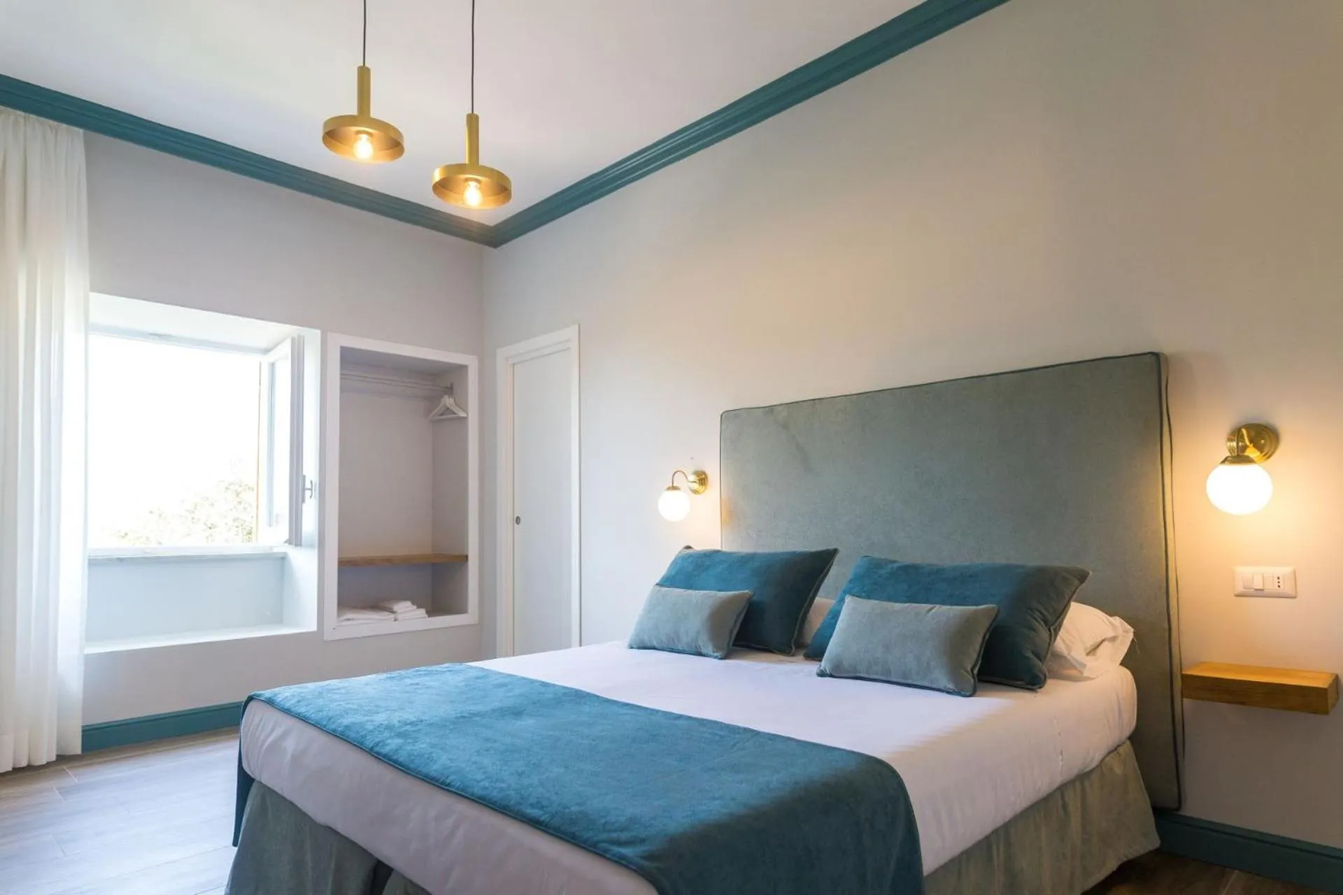 Bed in Sorrento Pool&Suites