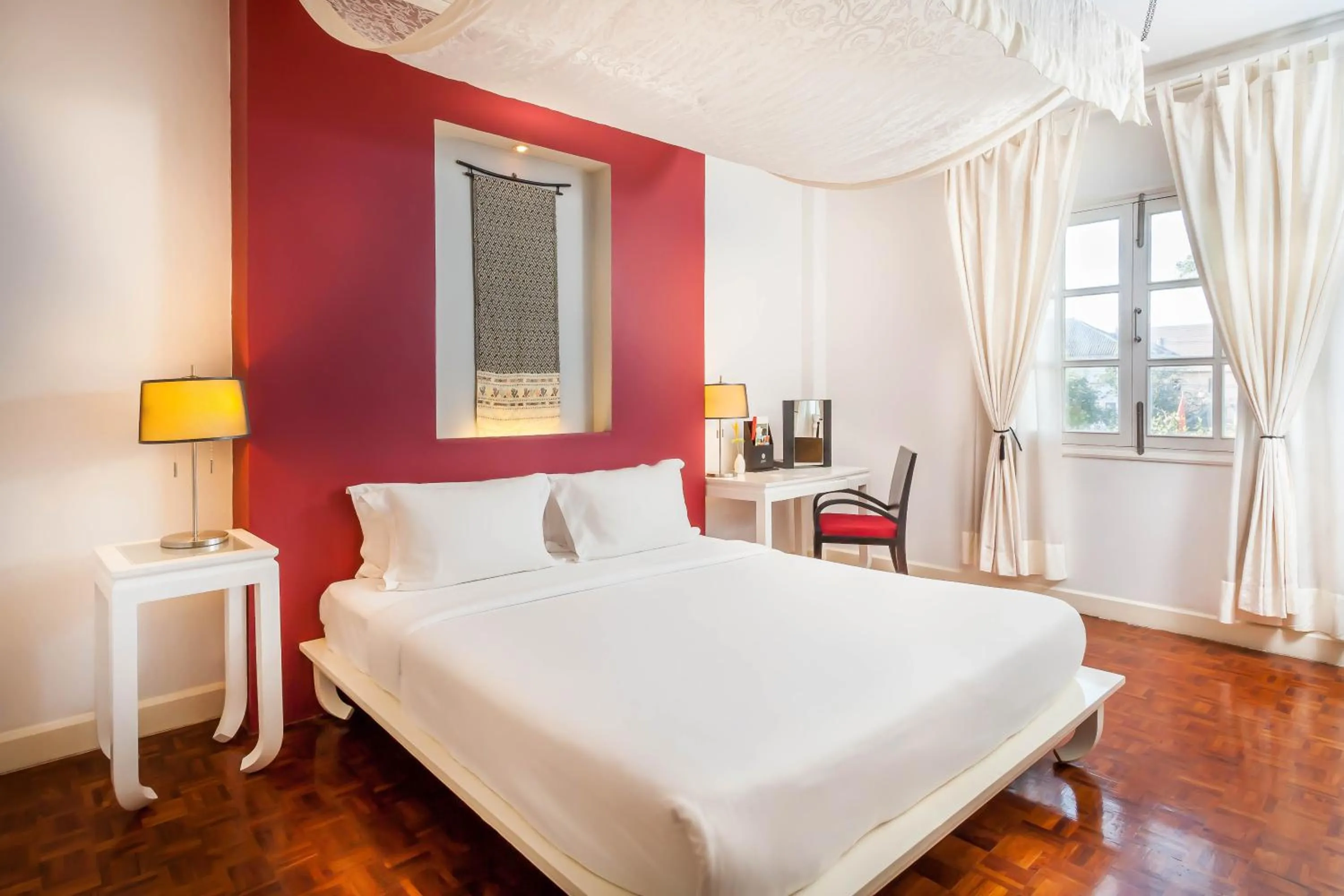 Bed in Homm Souvannaphoum Luang Prabang, part of Banyan Group