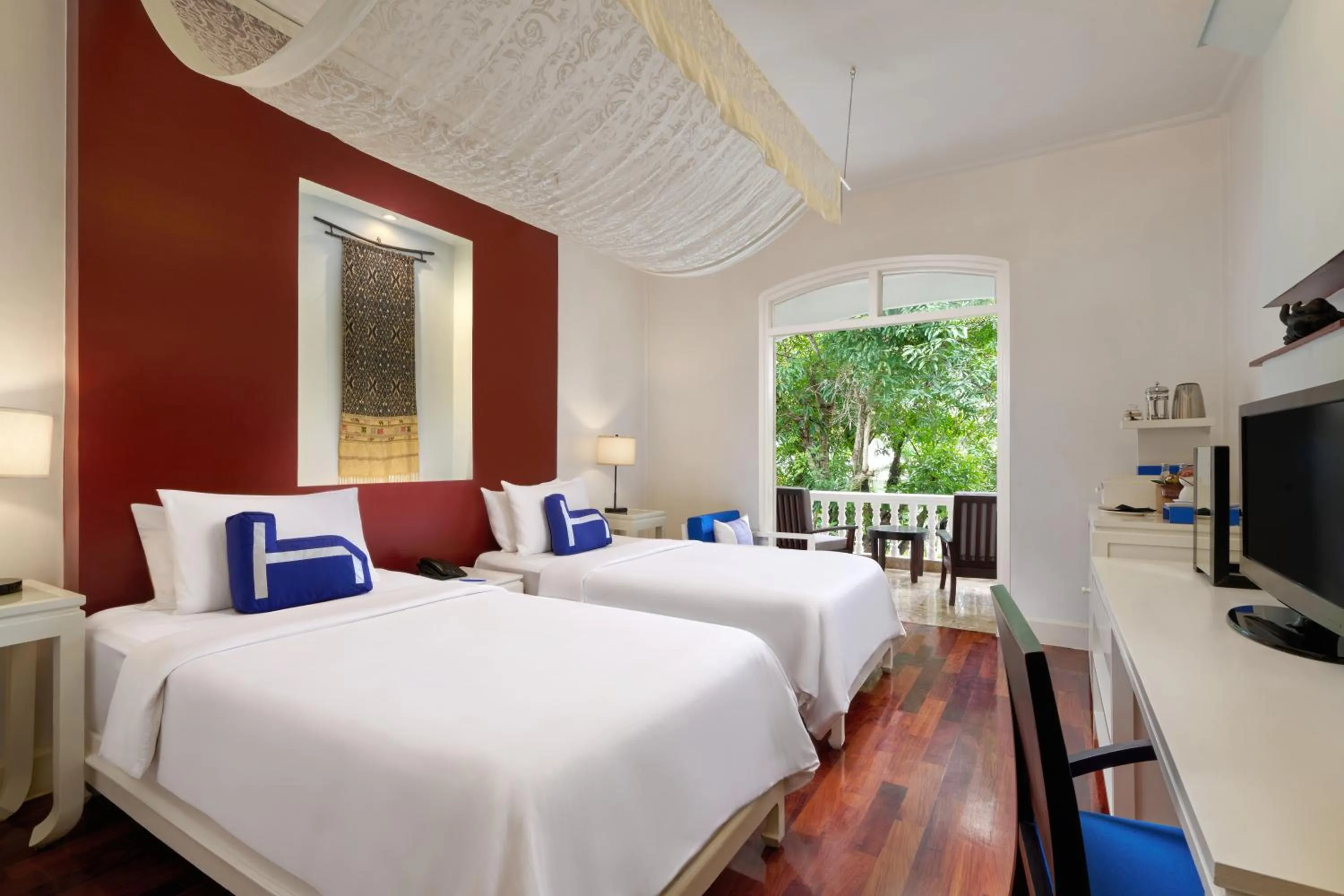 Bed in Homm Souvannaphoum Luang Prabang, part of Banyan Group