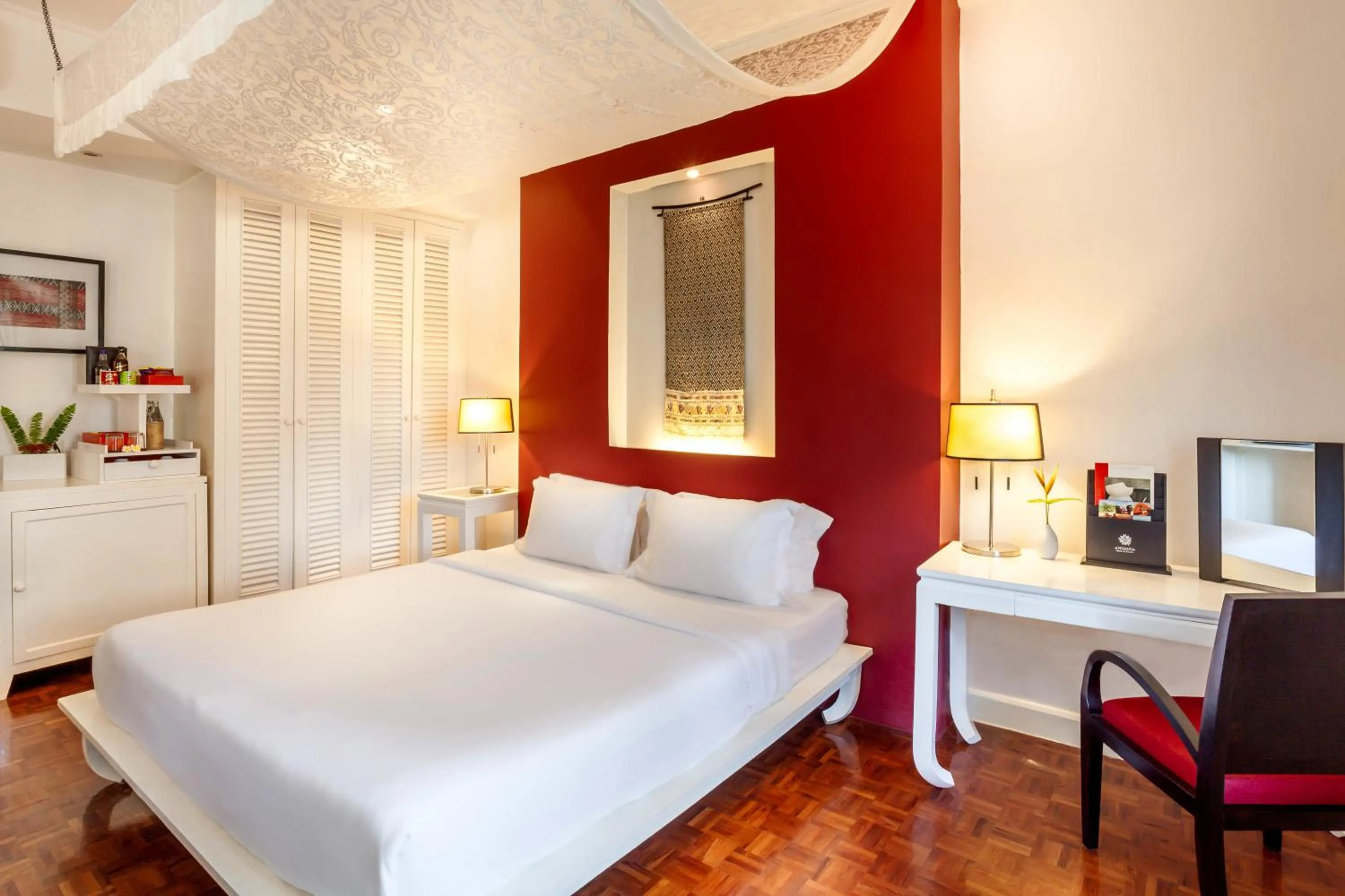 Bed in Homm Souvannaphoum Luang Prabang, part of Banyan Group