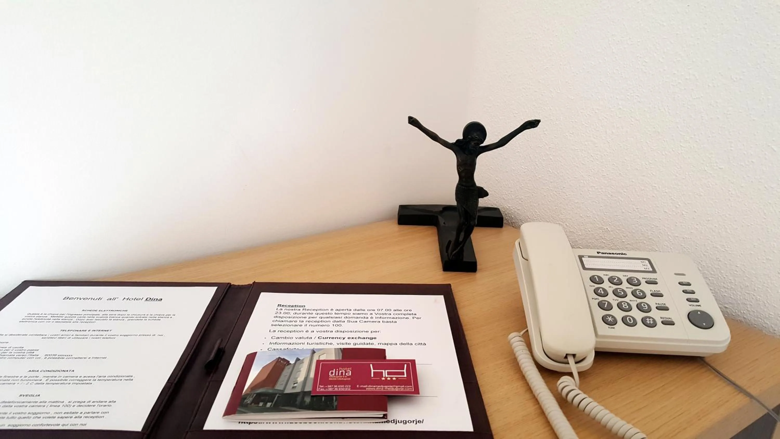 Property logo or sign in Hotel Dina