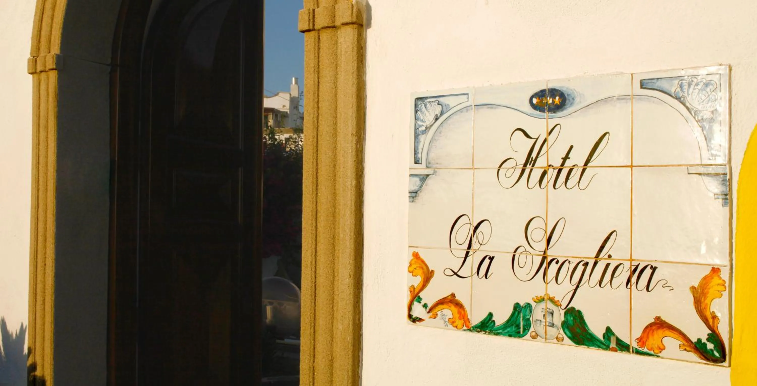 Property logo or sign in Hotel La Scogliera