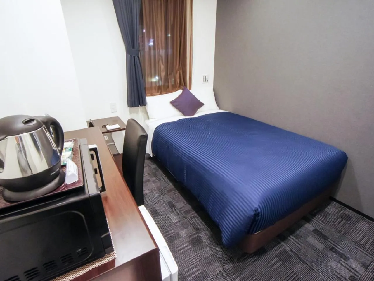 Bed in HOTEL LiVEMAX Nagoya Sakae East