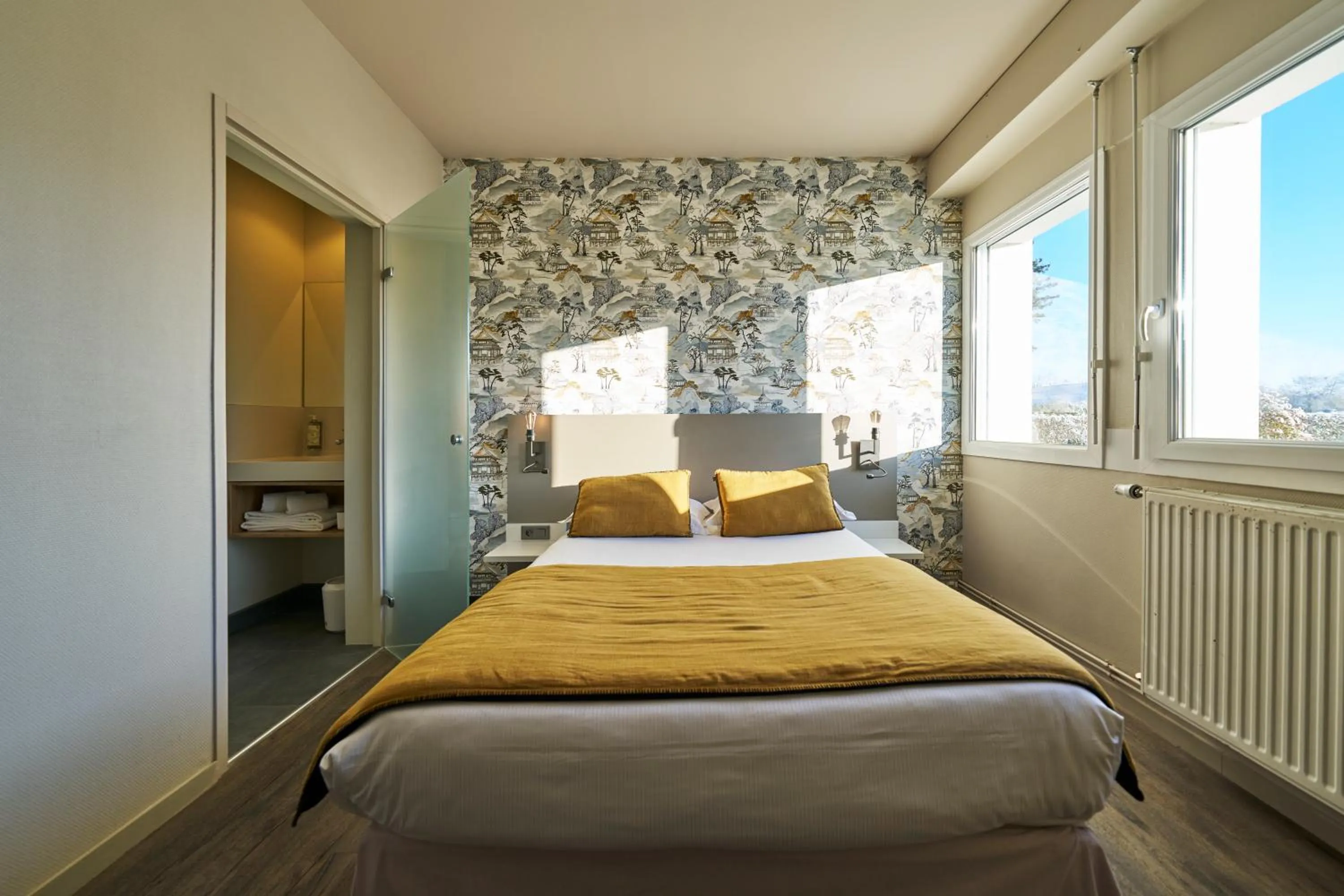 Bed in Hôtel le Corbusson Laval Ouest