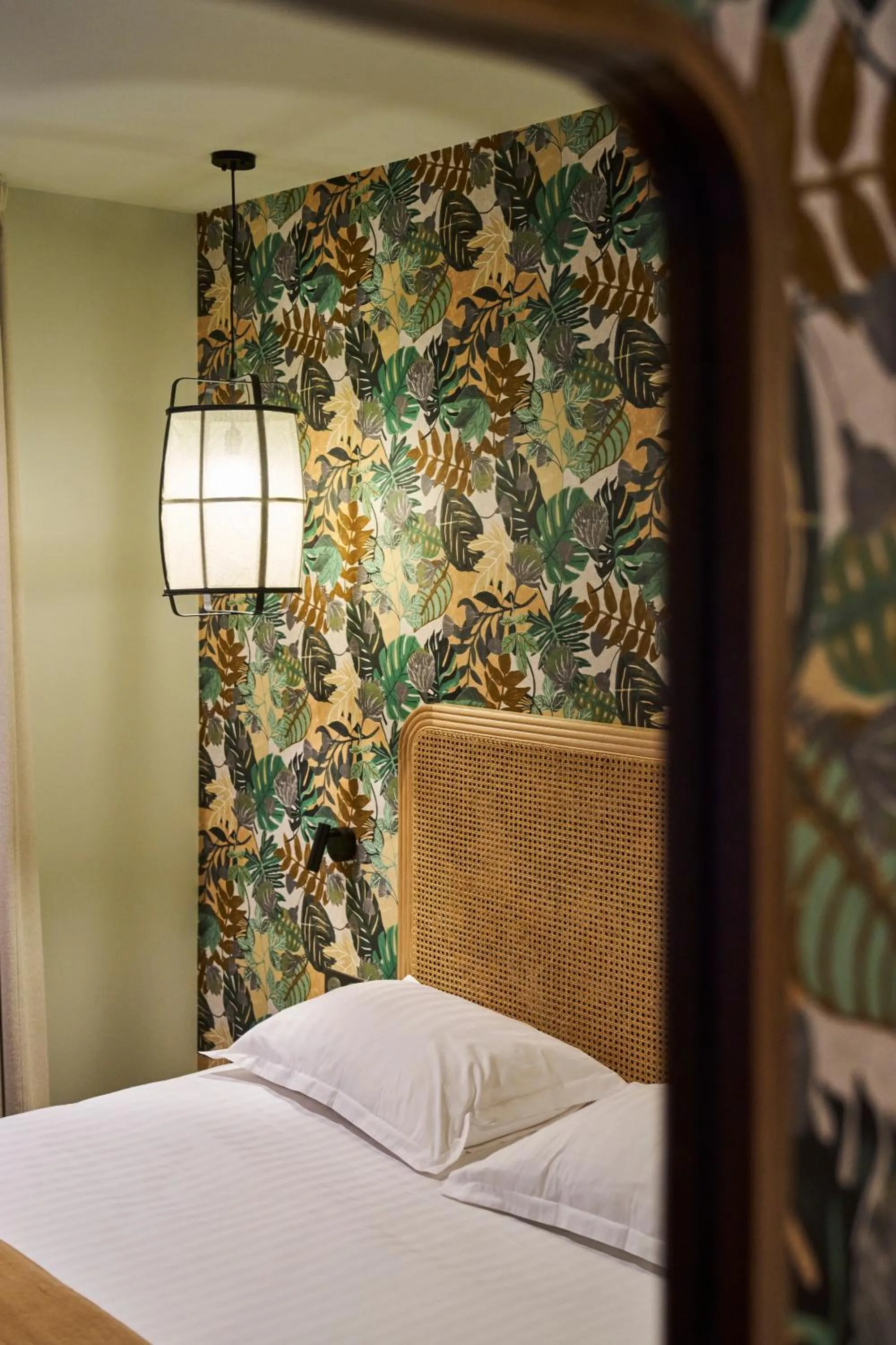 Decorative detail, Bed in Hôtel le Corbusson Laval Ouest