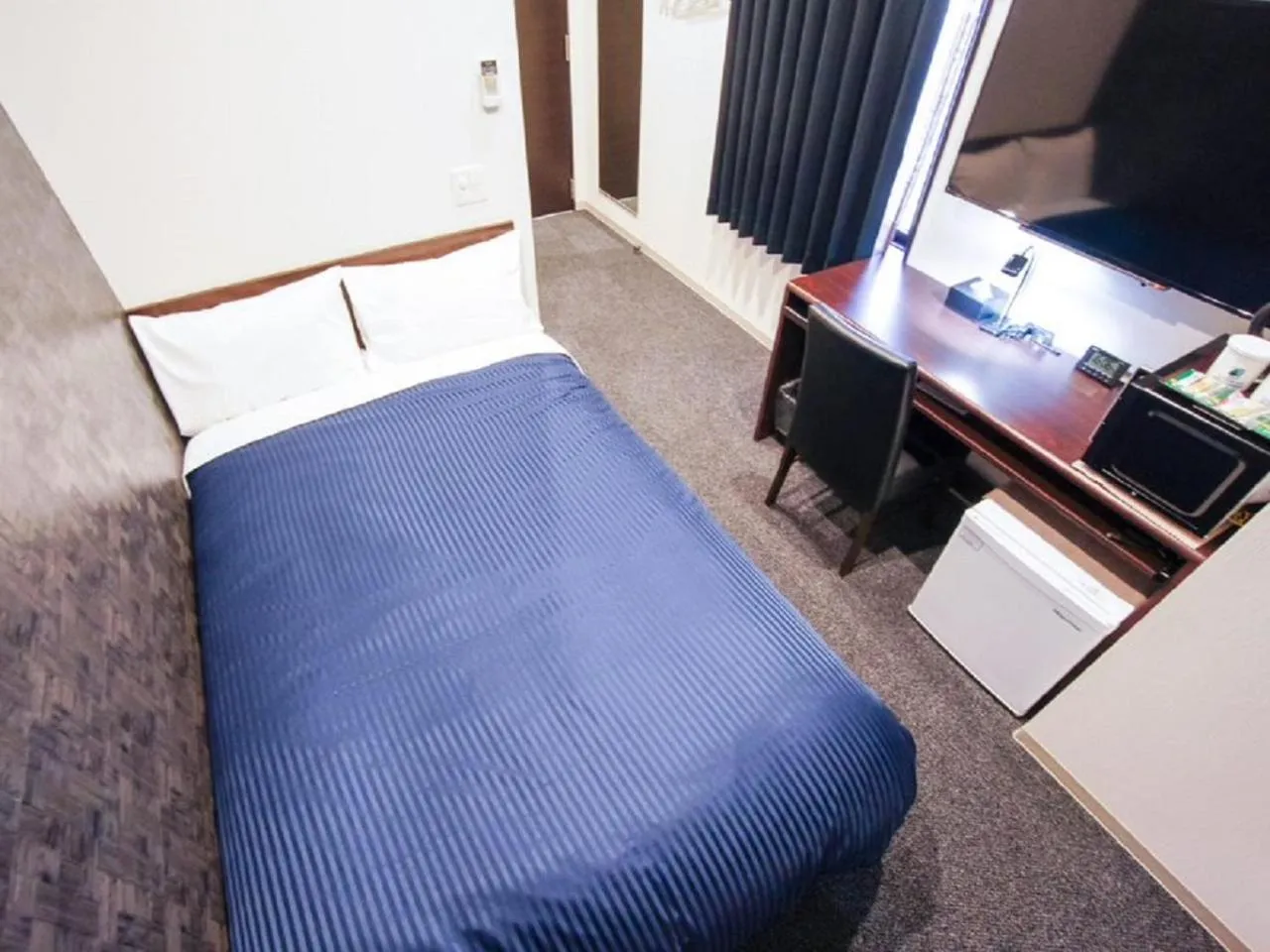 Bed in HOTEL LiVEMAX Himeji Shiyakusho Mae