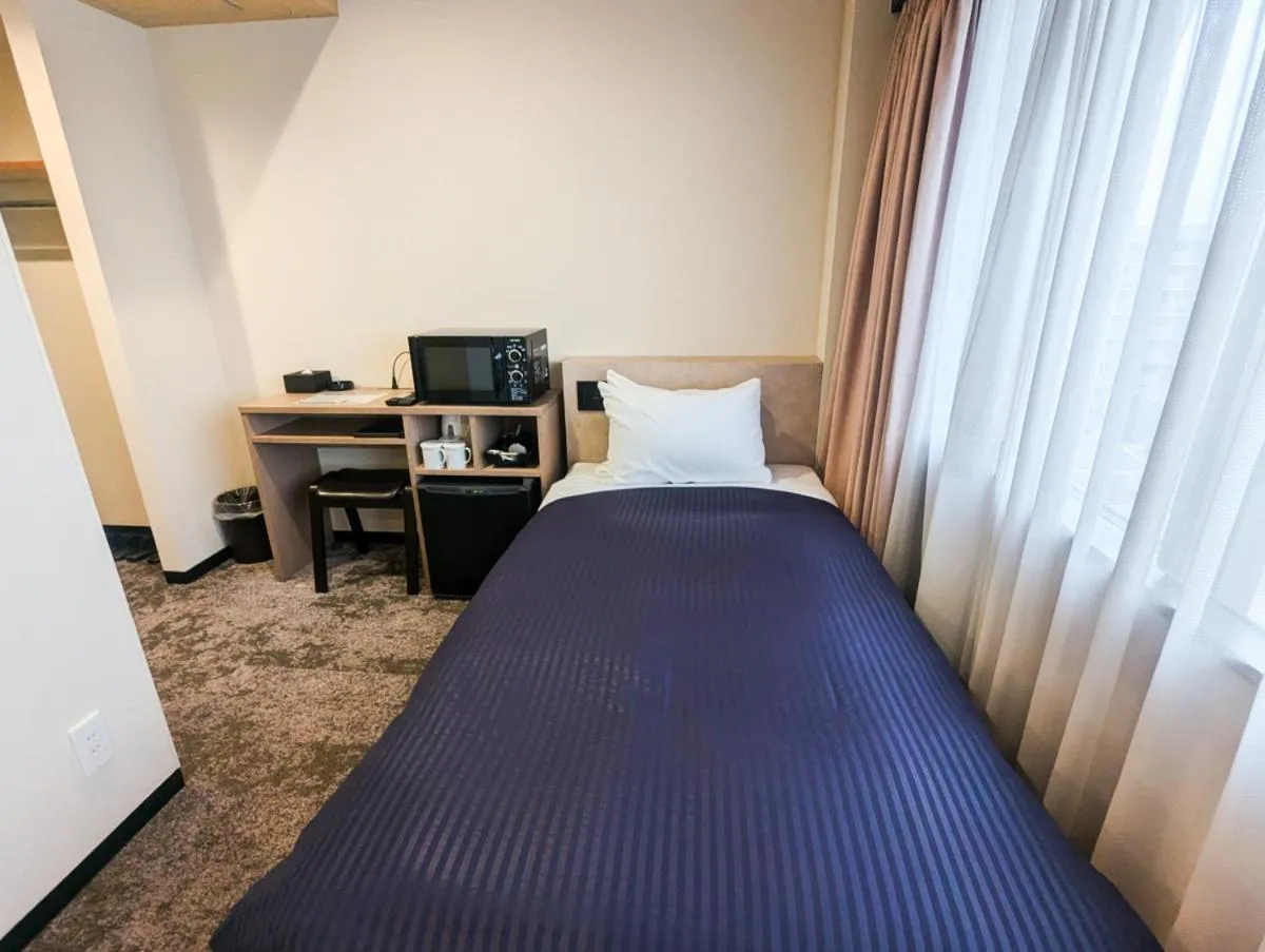 Bed in HOTEL LiVEMAX BUDGET Kagoshima